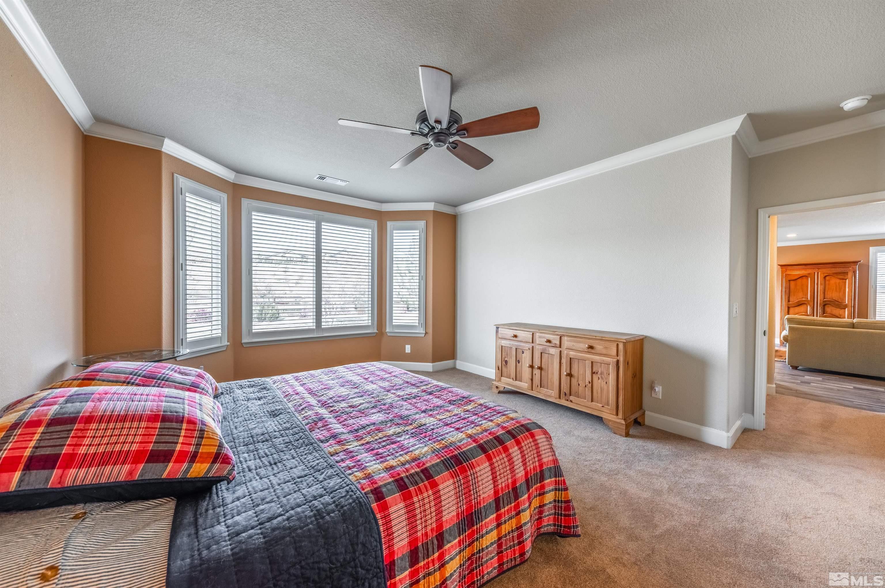 990 Broderick Trail Reno, NV 89523 - Photo 24 of 38 a bedroom with a bed and dresser
