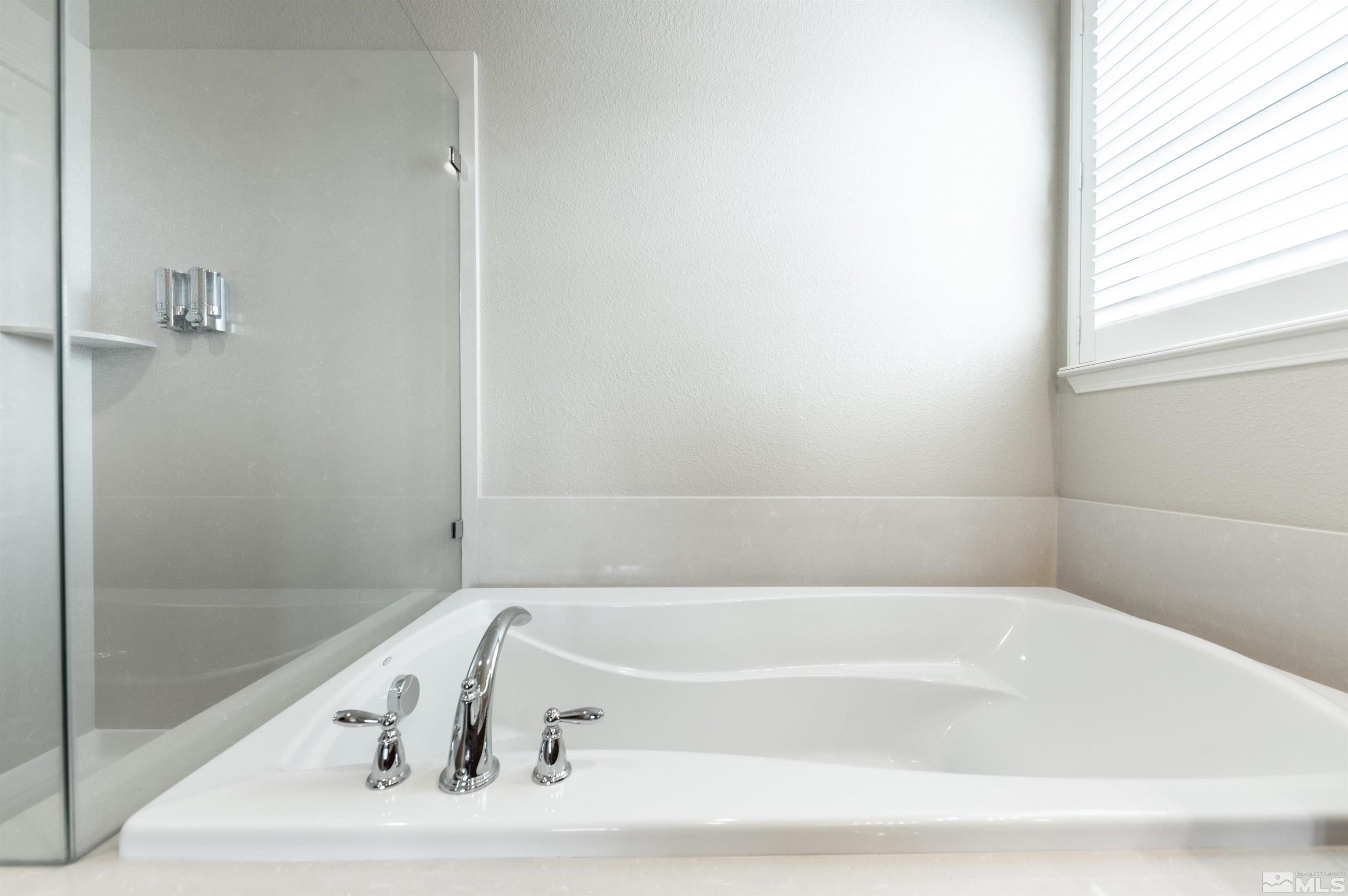 990 Broderick Trail Reno, NV 89523 - Photo 28 of 38 a white bath tub sitting next to a window