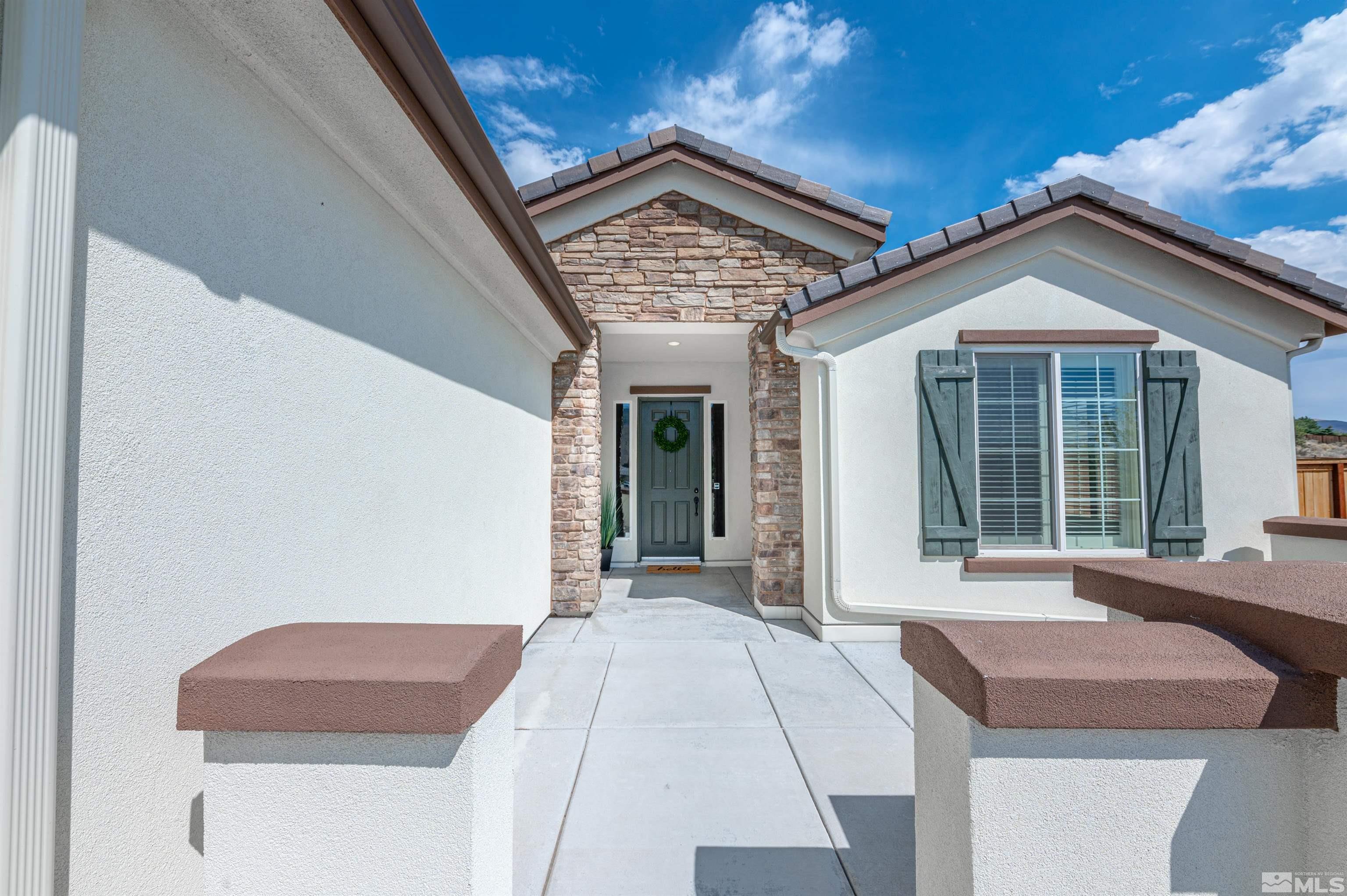 990 Broderick Trail Reno, NV 89523 - Photo 5 of 38 a front view of a house with a garage