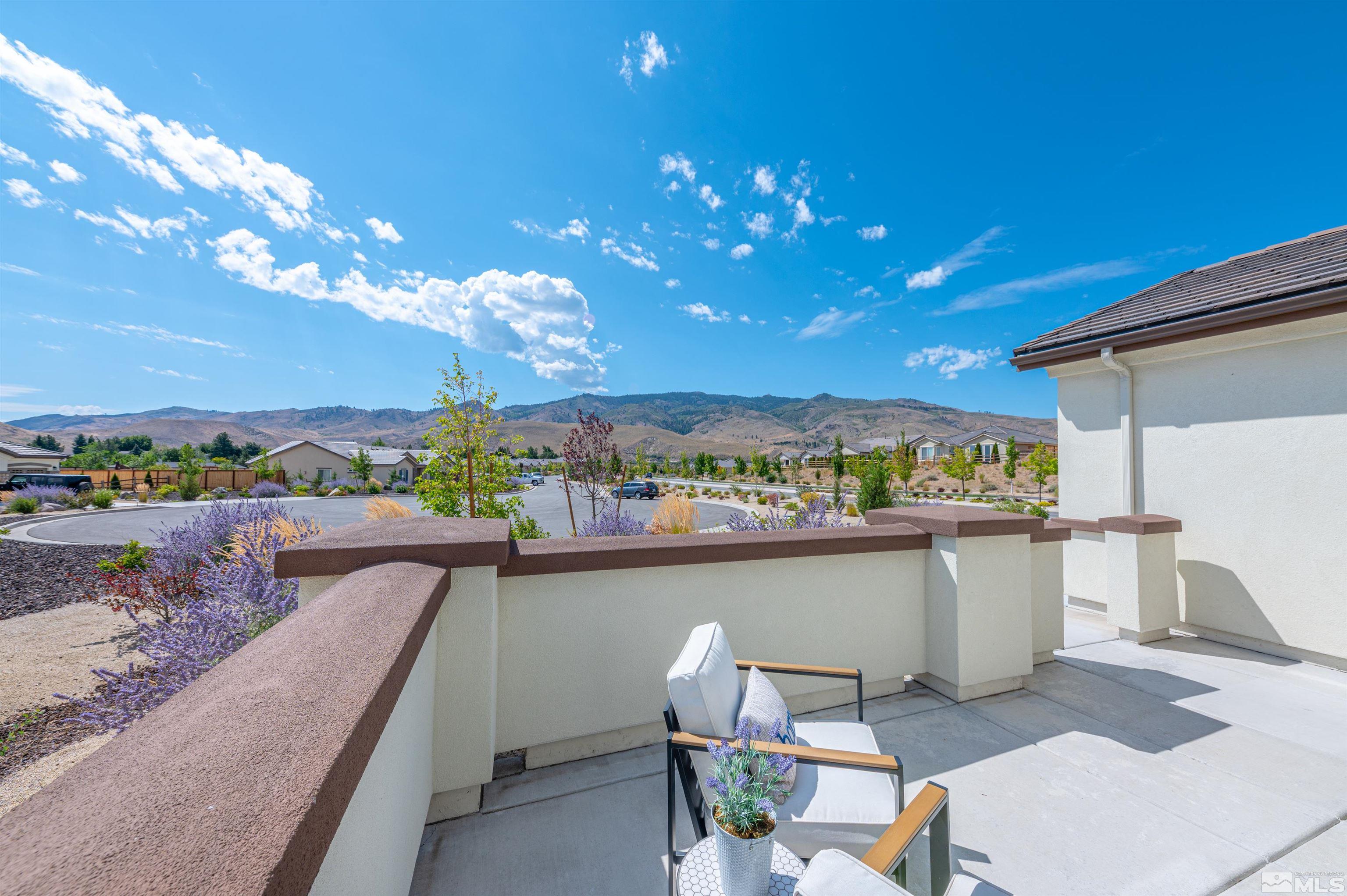 990 Broderick Trail Reno, NV 89523 - Photo 7 of 38 a view of a balcony with dining table and chairs