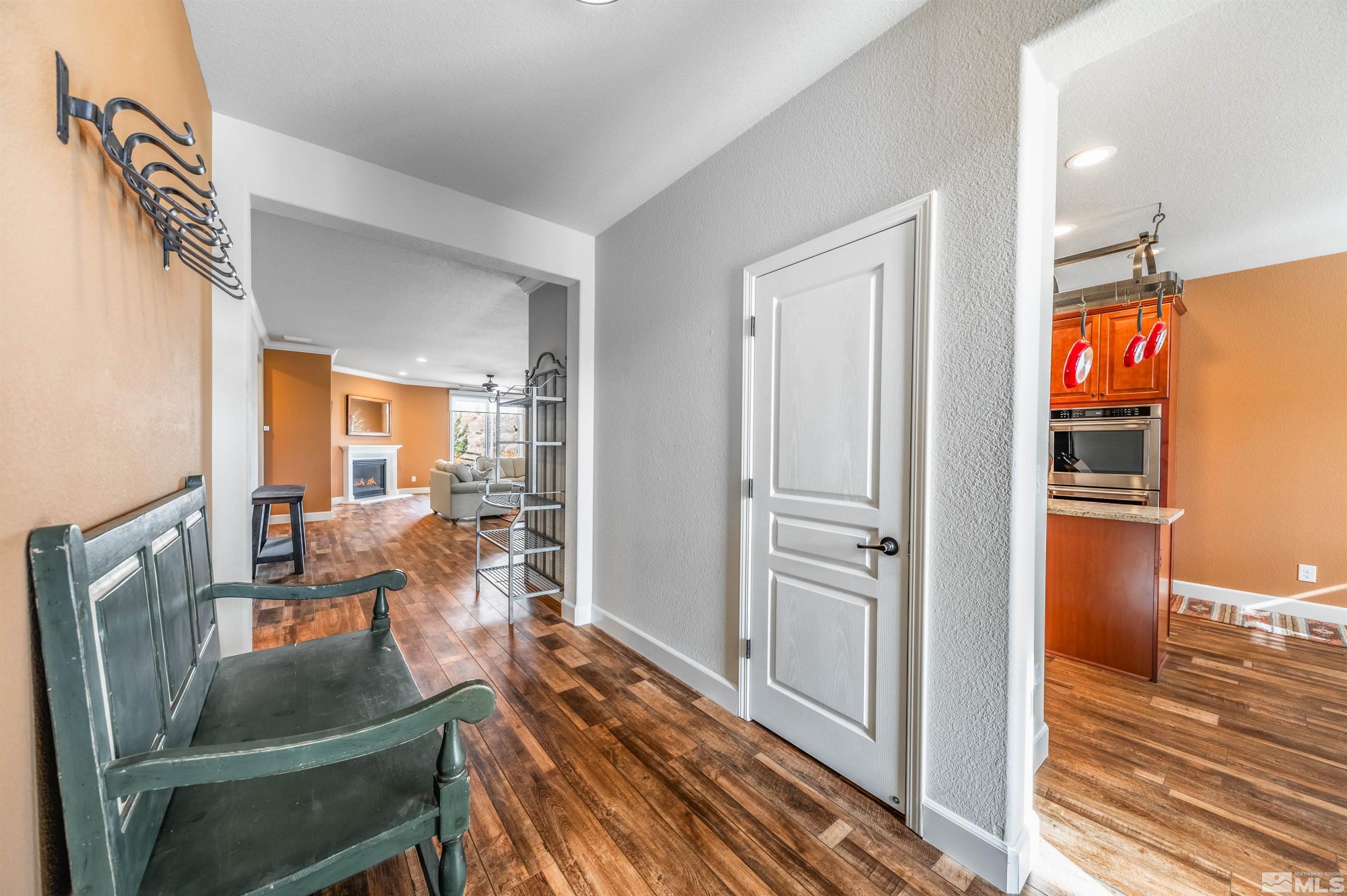 990 Broderick Trail Reno, NV 89523 - Photo 8 of 38 a view of a living room with furniture and wooden floor