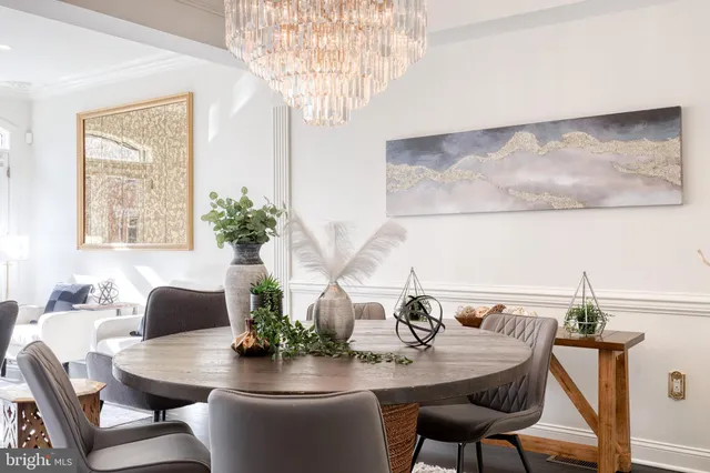 a dining room with furniture and wooden floor