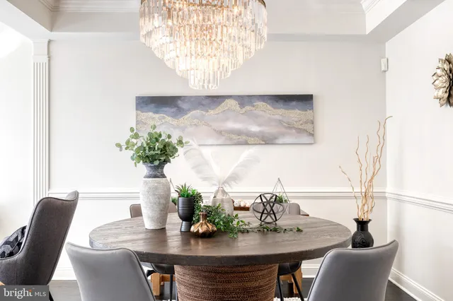 a dining room with furniture and wooden floor