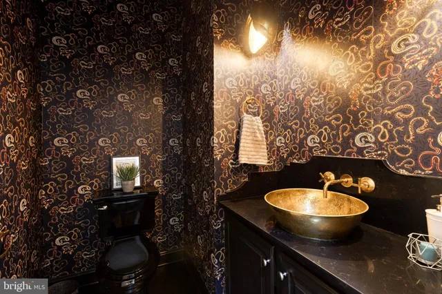 a spacious bedroom with a bed and a fireplace