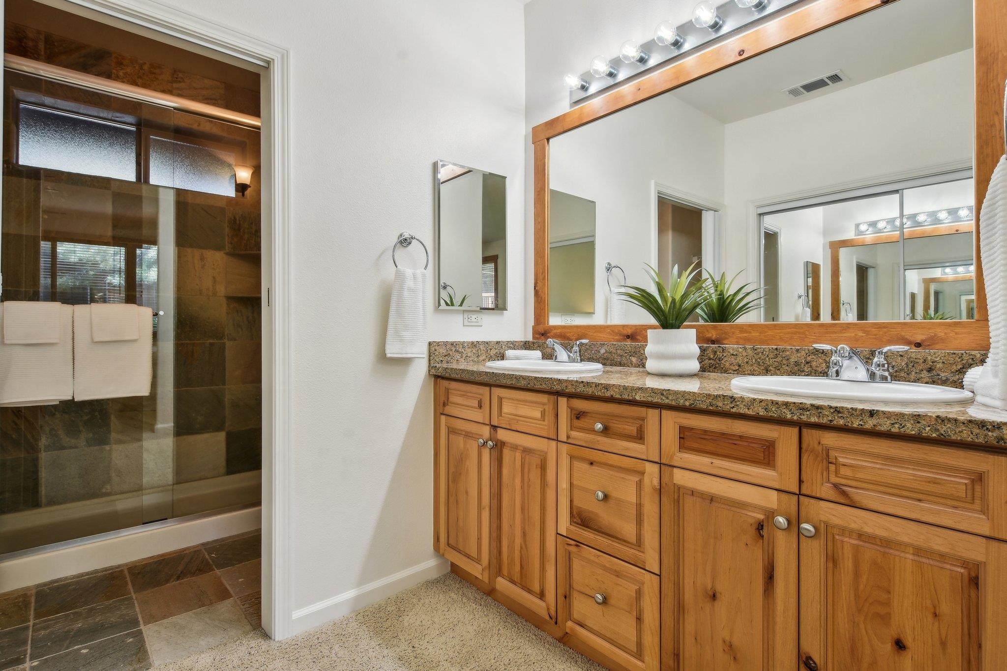 10844 Cinnabar Way, Unit 3 Truckee, CA 96161 - Photo 12 of 28 a bathroom with a granite countertop sink and a mirror