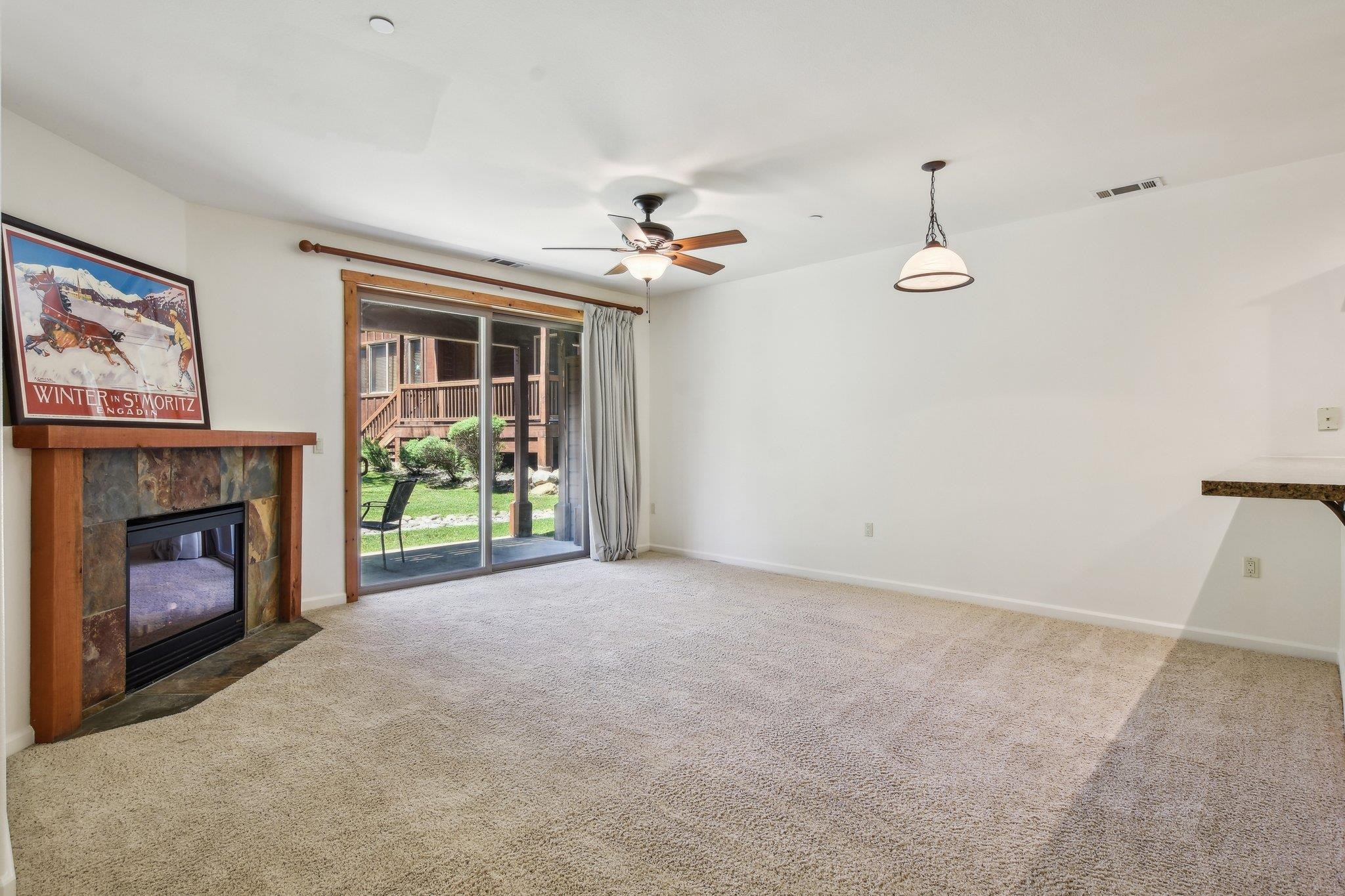 10844 Cinnabar Way, Unit 3 Truckee, CA 96161 - Photo 2 of 28 a view of empty room with fireplace and fan