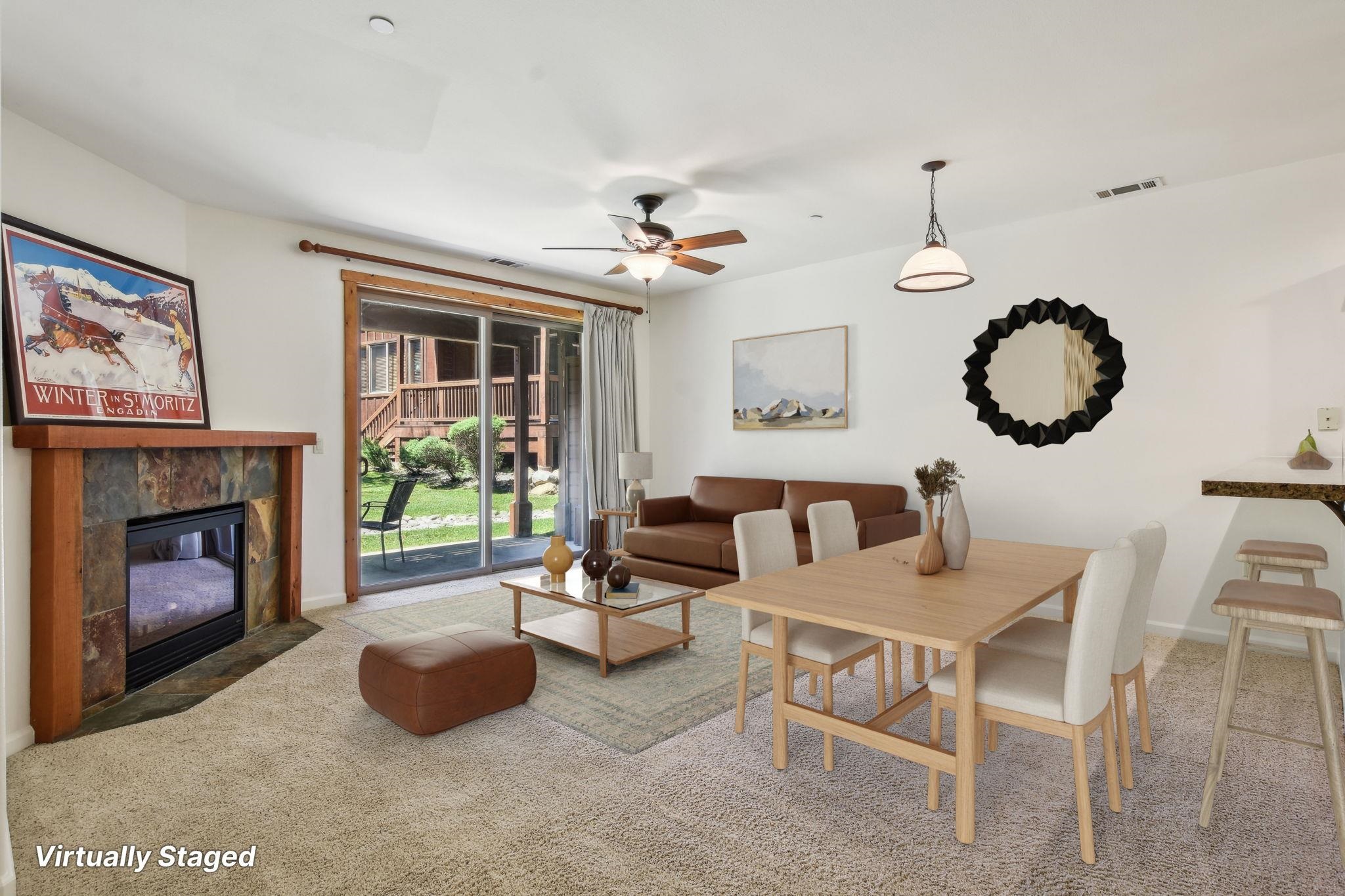 10844 Cinnabar Way, Unit 3 Truckee, CA 96161 - Photo 3 of 28 a living room with furniture a fireplace and a large window