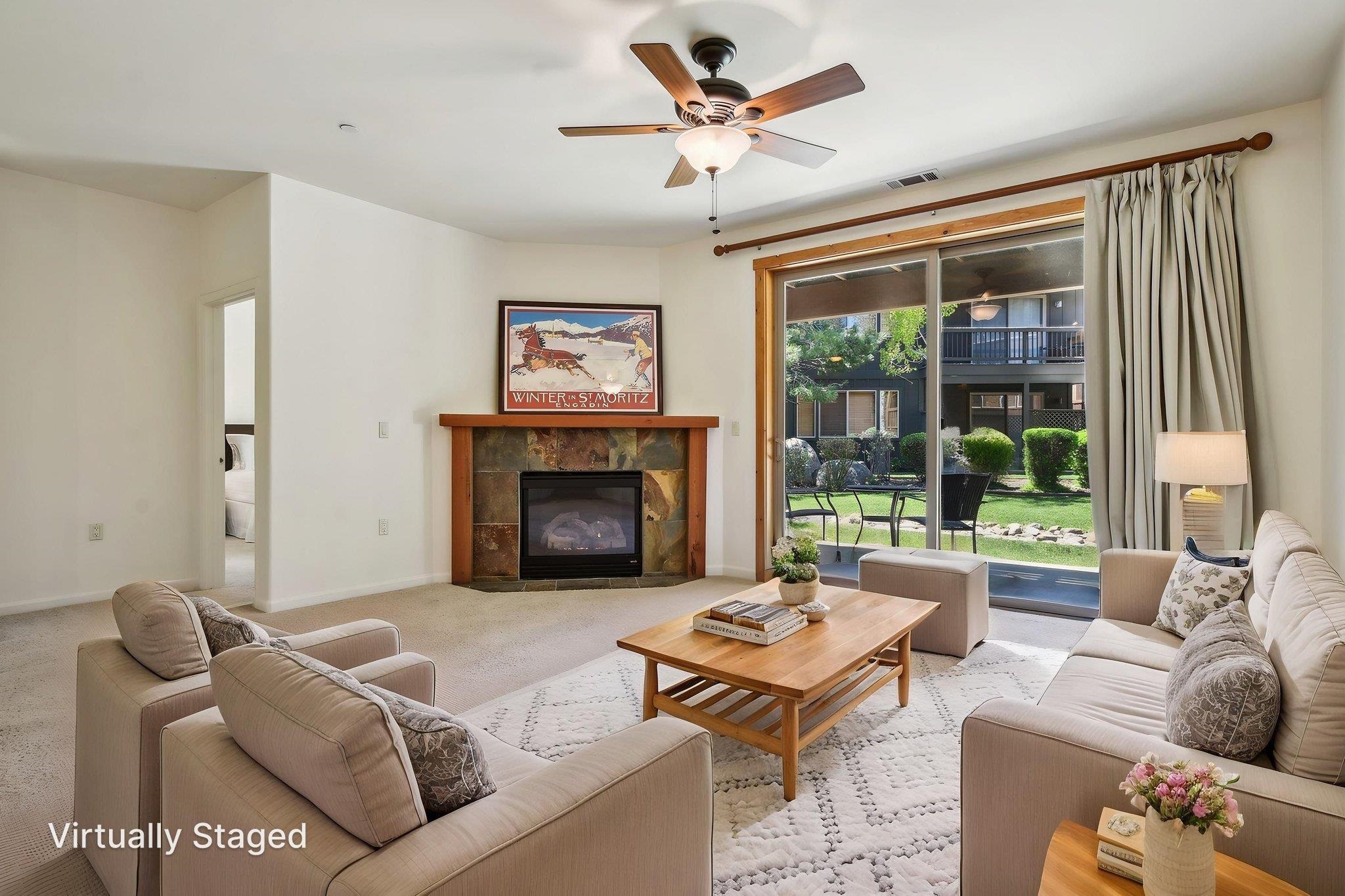 10844 Cinnabar Way, Unit 3 Truckee, CA 96161 - Photo 7 of 28 a living room with furniture and a fireplace