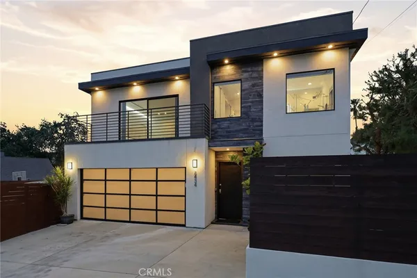 a front view of a house with a garage