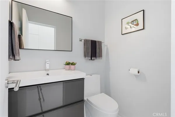 a kitchen with stainless steel appliances kitchen island granite countertop a refrigerator and microwave