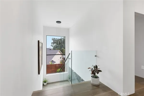 a view of a room with wooden floor and cabinet