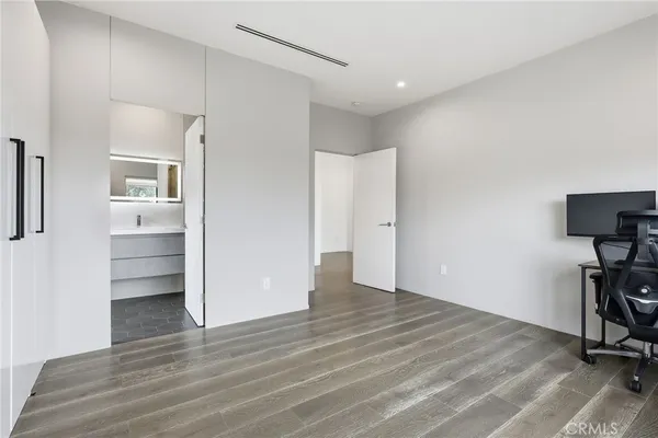 a bathroom with a sink toilet and mirror