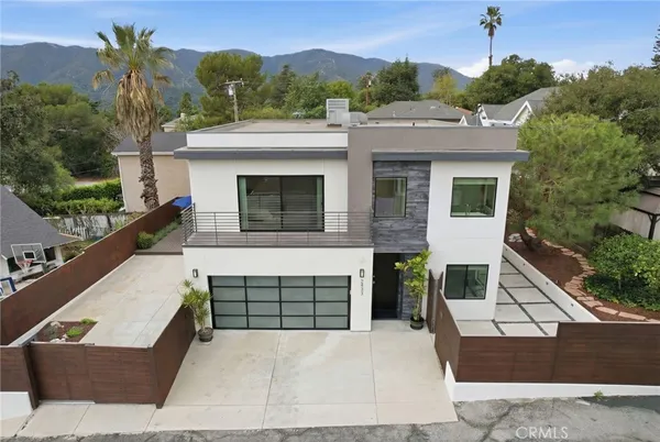 a front view of a house with a garage