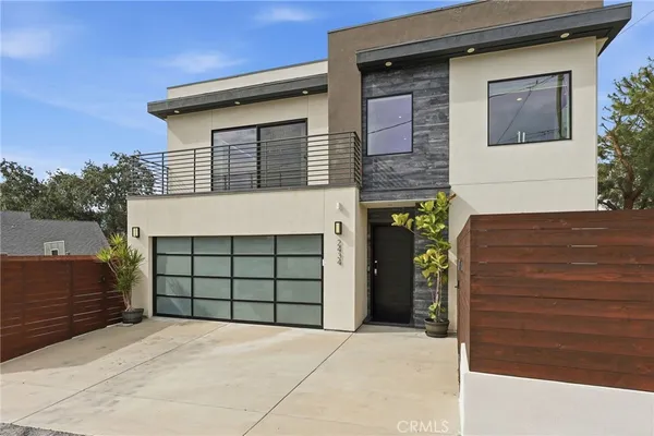 a front view of a house with a garage