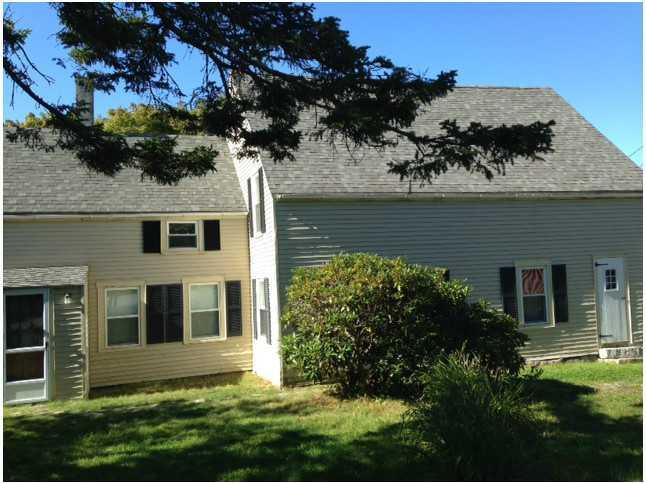 7 Mountain Street Vinalhaven, ME 04863 - Photo 1 of 15 Exterior Front. with shady yard in...