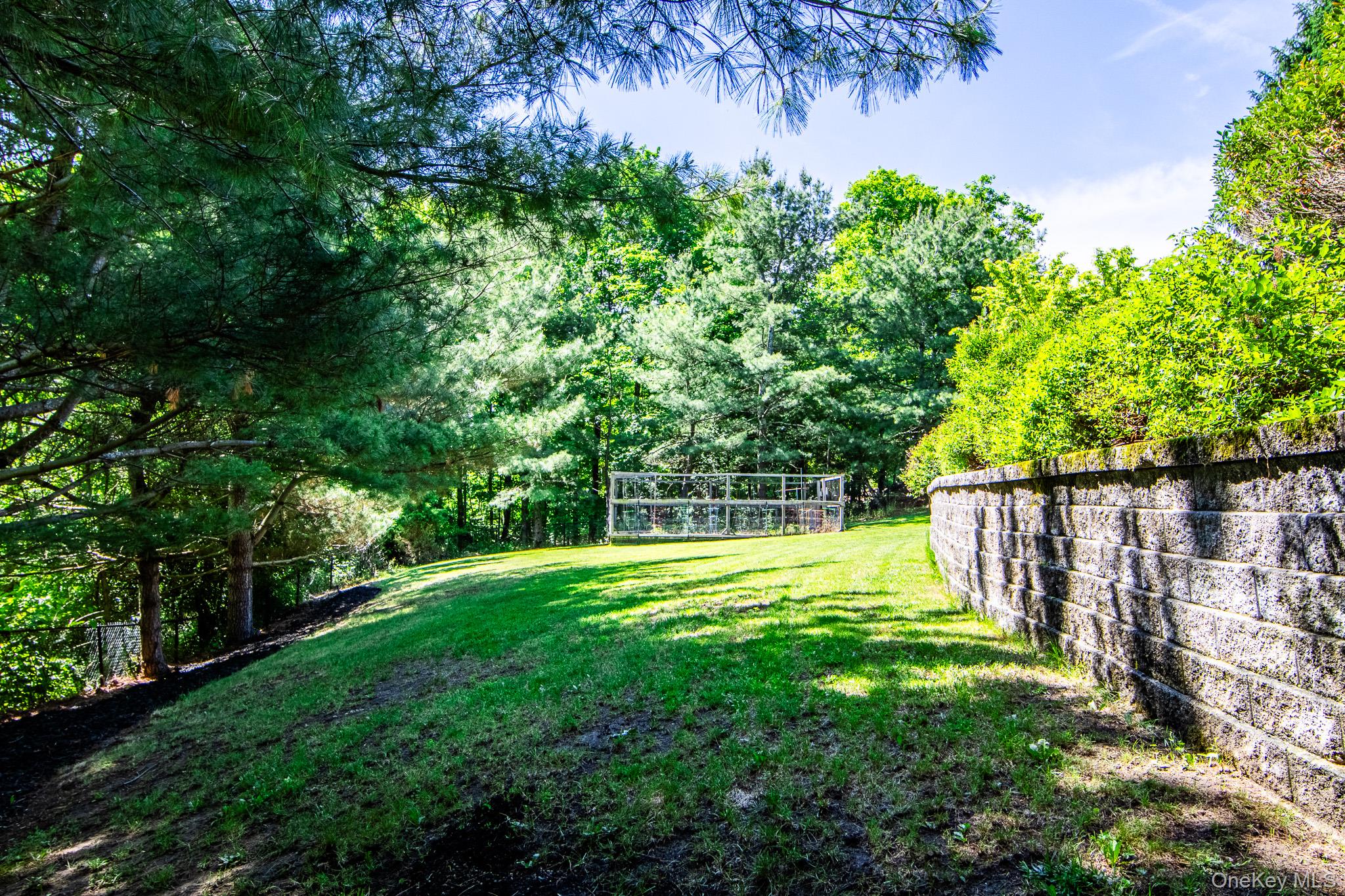 214 West Mombasha Road Monroe, NY 10950 - Photo 38 of 43 a view of a backyard with a garden