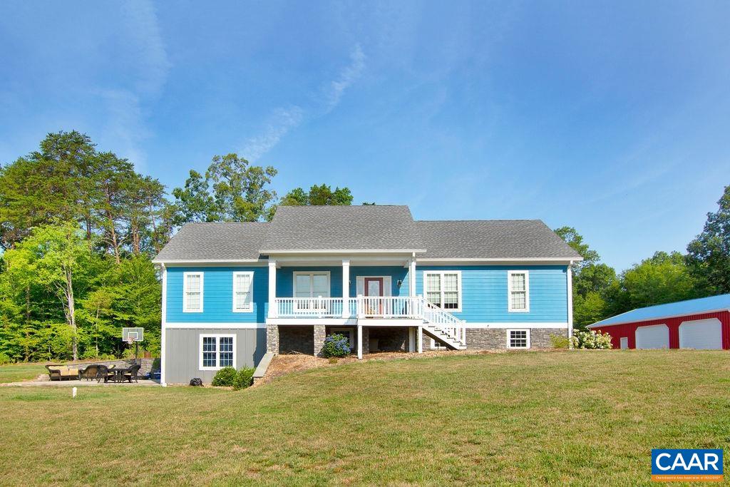 1275 Poplar Spring Road Scottsville, VA 24590 - Photo 1 of 51 a front view of a house with garden