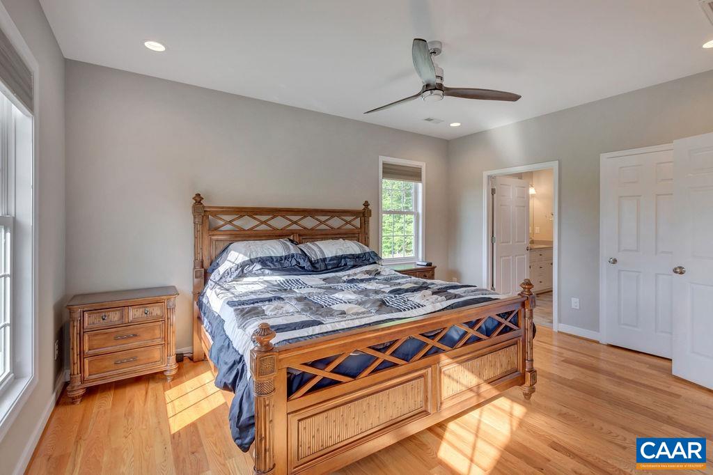 1275 Poplar Spring Road Scottsville, VA 24590 - Photo 16 of 51 a bedroom with a bed and wooden floor