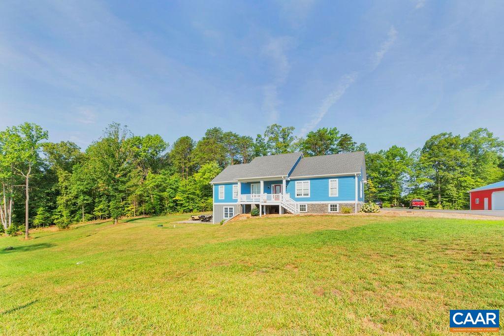 1275 Poplar Spring Road Scottsville, VA 24590 - Photo 36 of 51 a front view of a house with a yard and swimming pool
