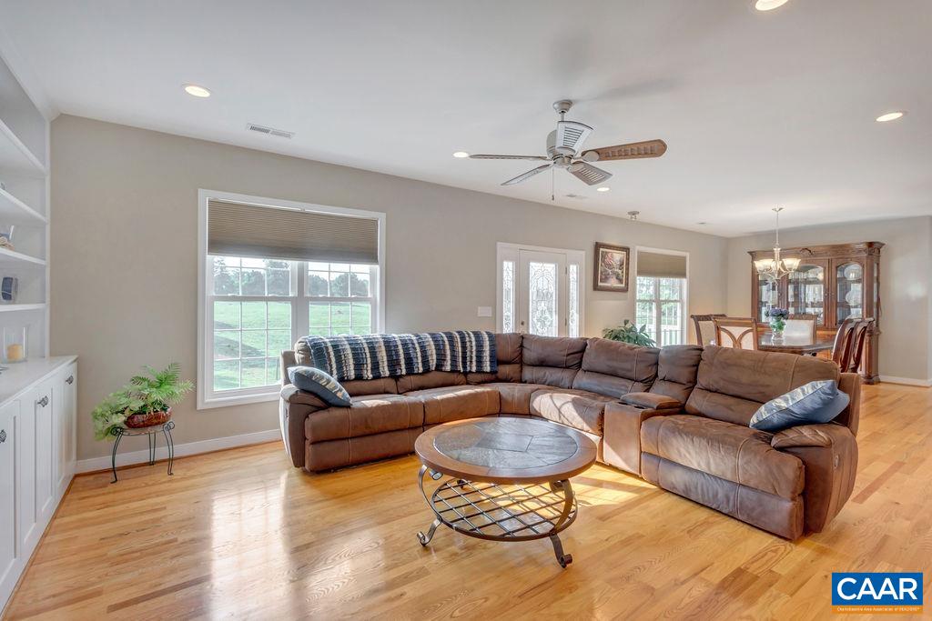 1275 Poplar Spring Road Scottsville, VA 24590 - Photo 10 of 51 a living room with furniture ceiling fan and a window