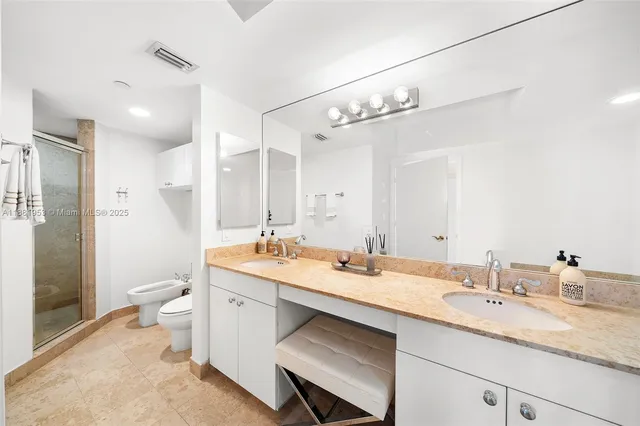 a large bathroom with a bathtub a sink and a mirror