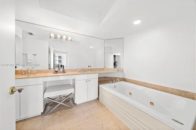 a bedroom with two beds and a window