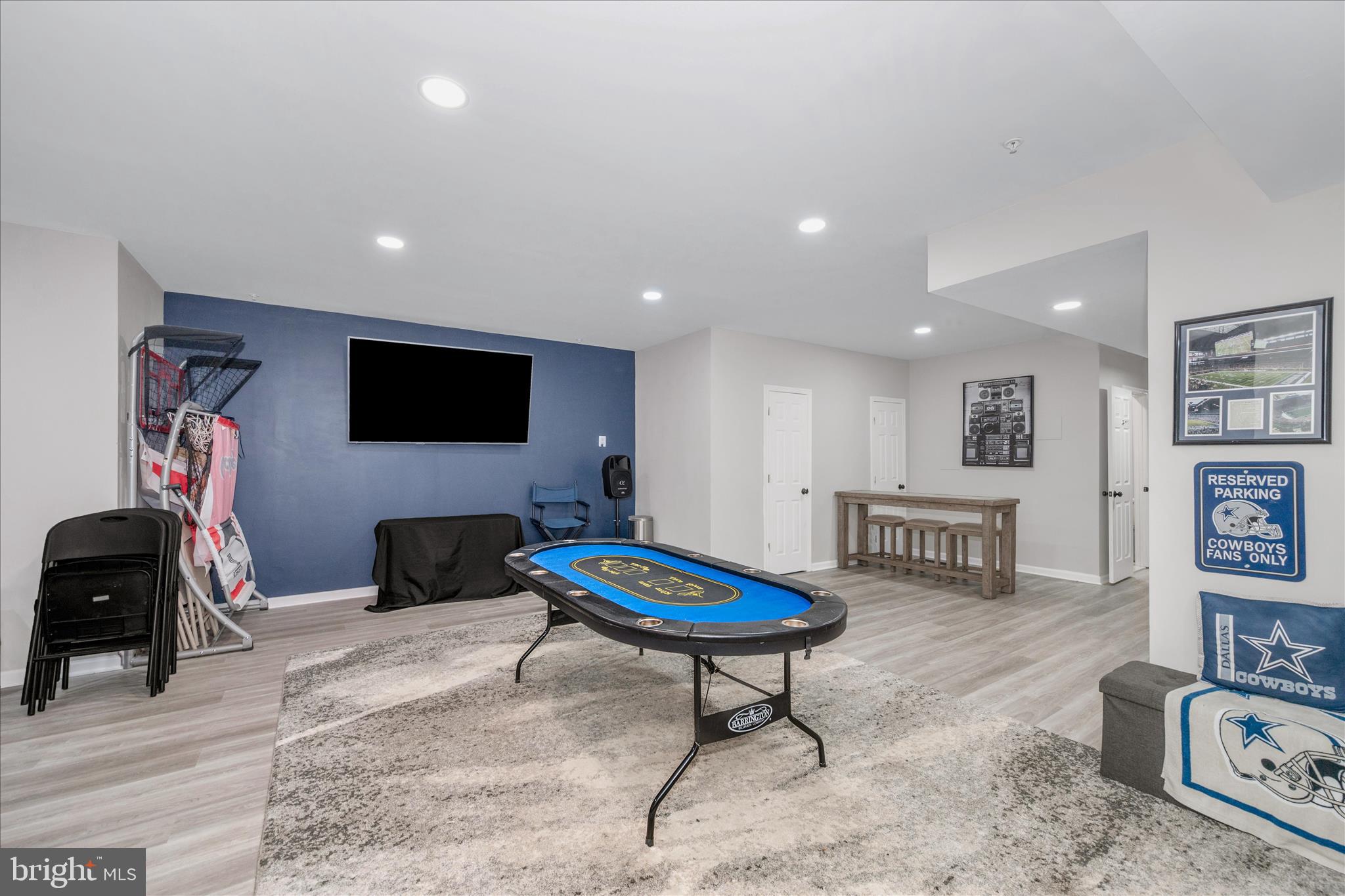 1388 Rocky Springs Road Frederick, MD 21702 - Photo 53 of 97 a living room with furniture a flat screen tv and a table