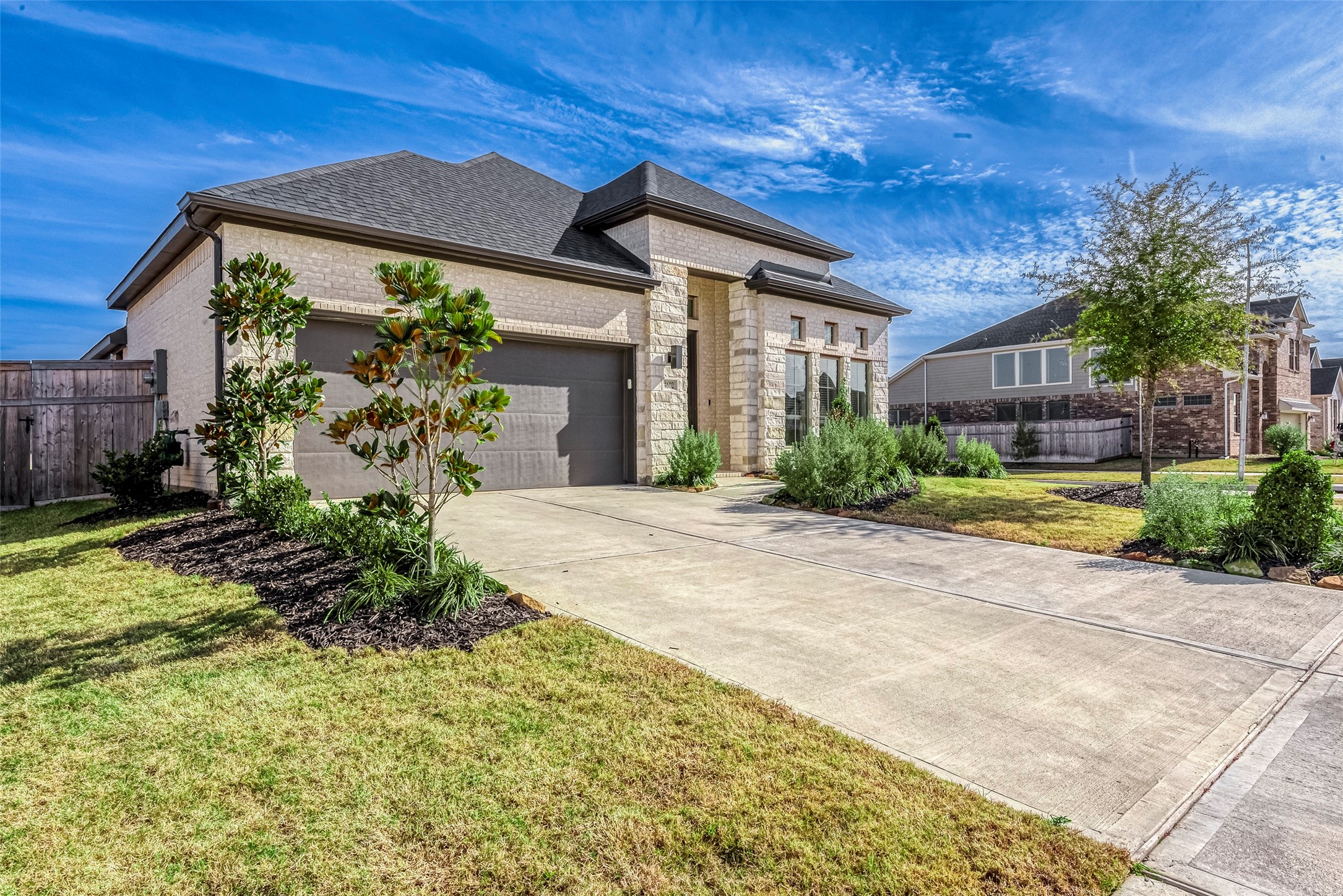 a front view of a house with garden