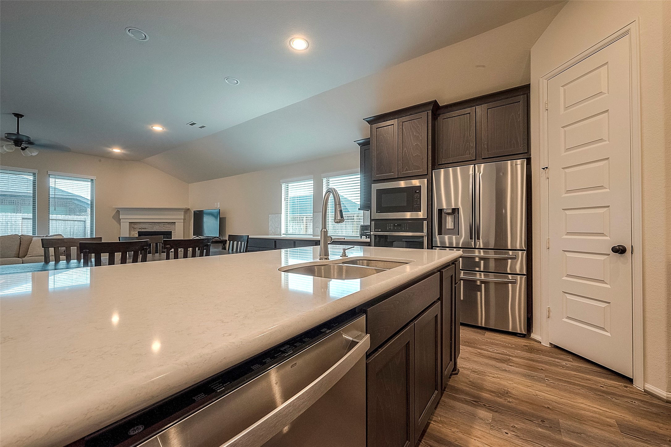 4602 Ana Ridge Lane Fulshear, TX 77441 - Photo 11 of 42 a kitchen with stainless steel appliances granite countertop a refrigerator a sink and a stove