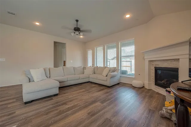 a living room with furniture and a fireplace