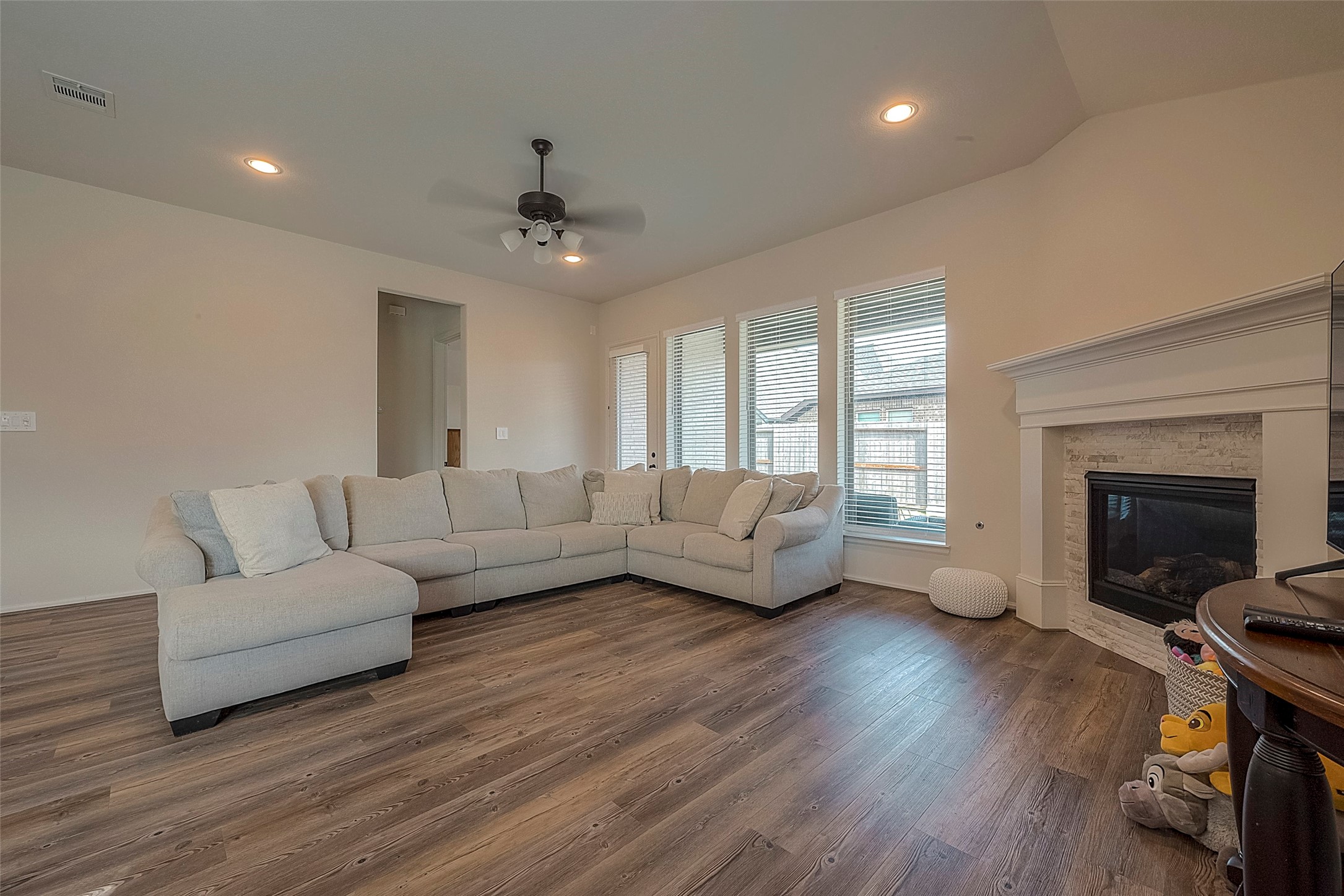 4602 Ana Ridge Lane Fulshear, TX 77441 - Photo 14 of 42 a living room with furniture and a fireplace