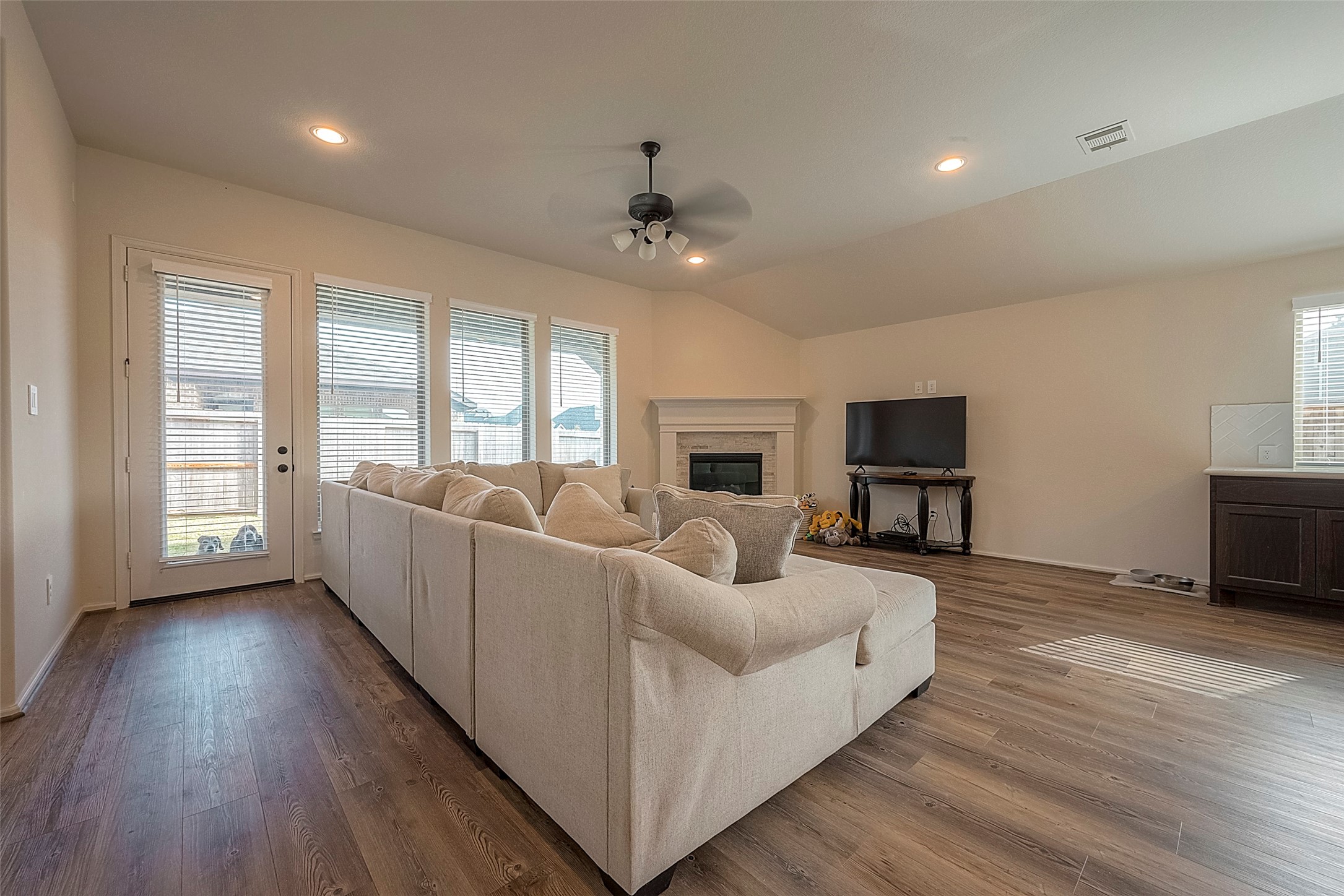 4602 Ana Ridge Lane Fulshear, TX 77441 - Photo 15 of 42 a living room with furniture and a flat screen tv