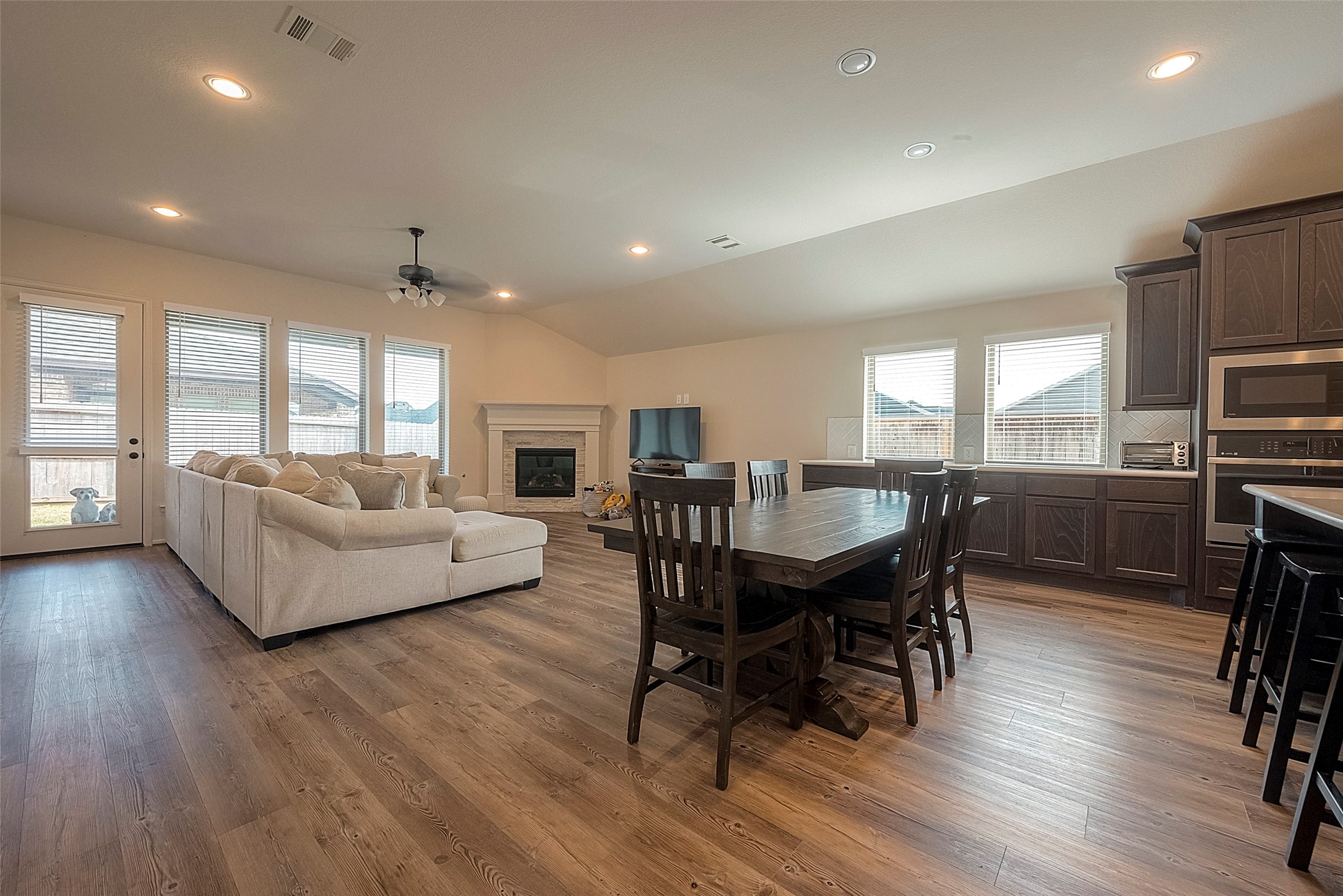 4602 Ana Ridge Lane Fulshear, TX 77441 - Photo 16 of 42 a living room with furniture a dining table and a large window