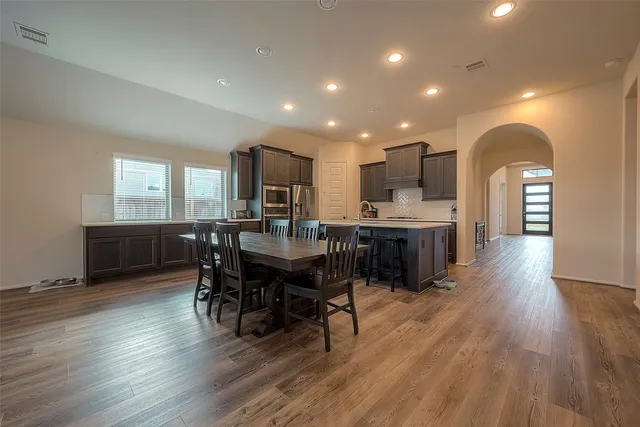 a view of kitchen with cabinets and wooden floor