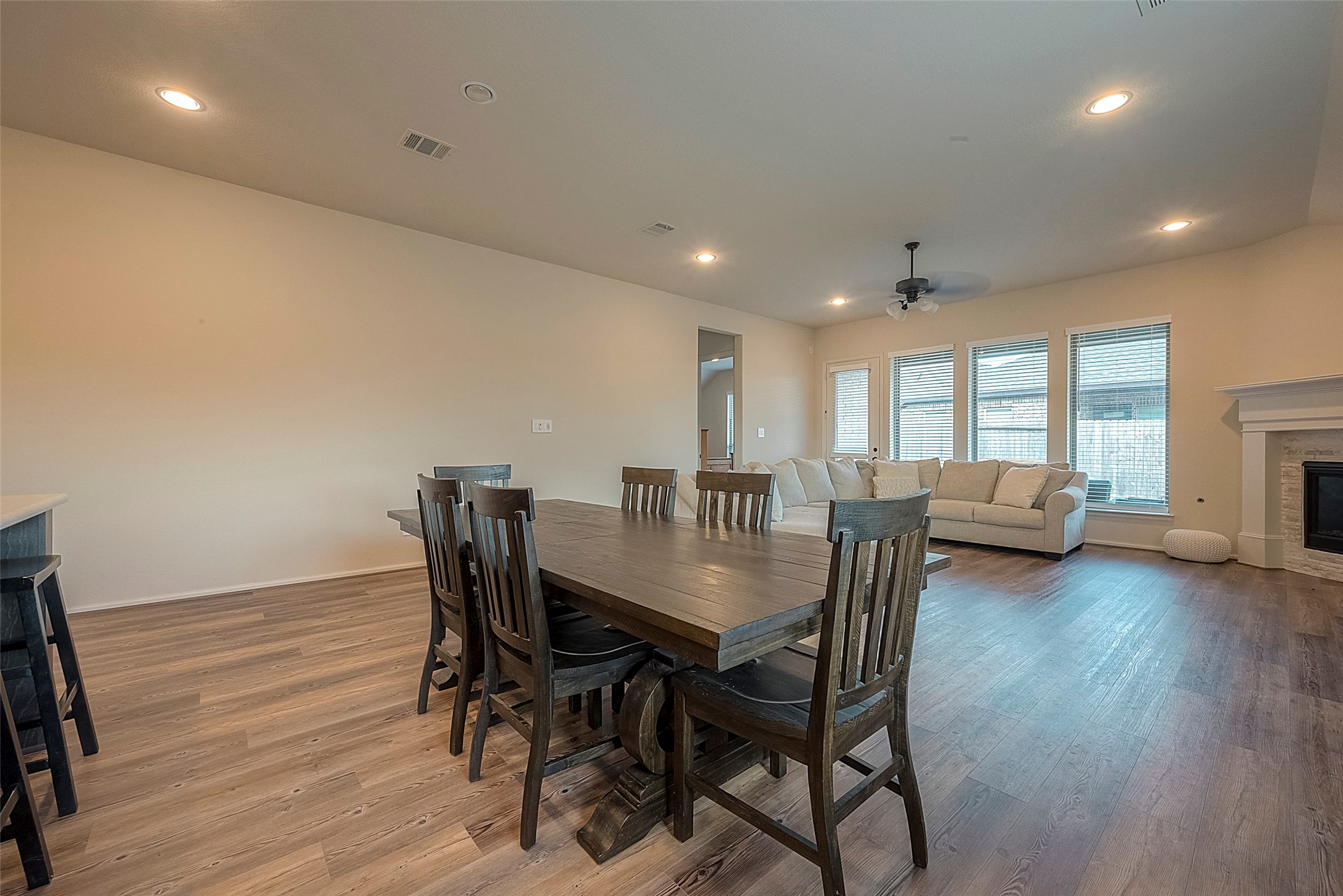 4602 Ana Ridge Lane Fulshear, TX 77441 - Photo 20 of 42 a view of a dining room with furniture and wooden floor