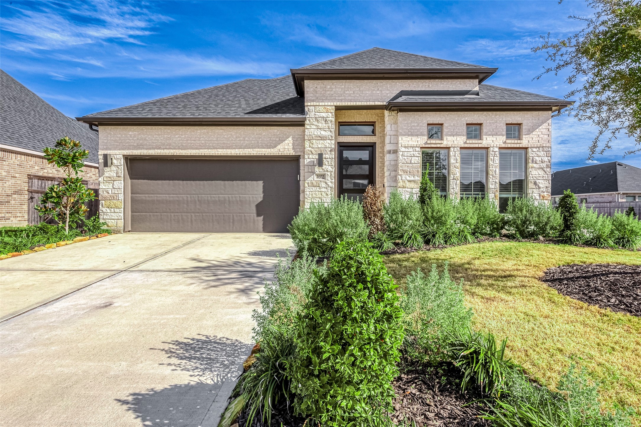 4602 Ana Ridge Lane Fulshear, TX 77441 - Photo 2 of 42 a front view of a house with a yard