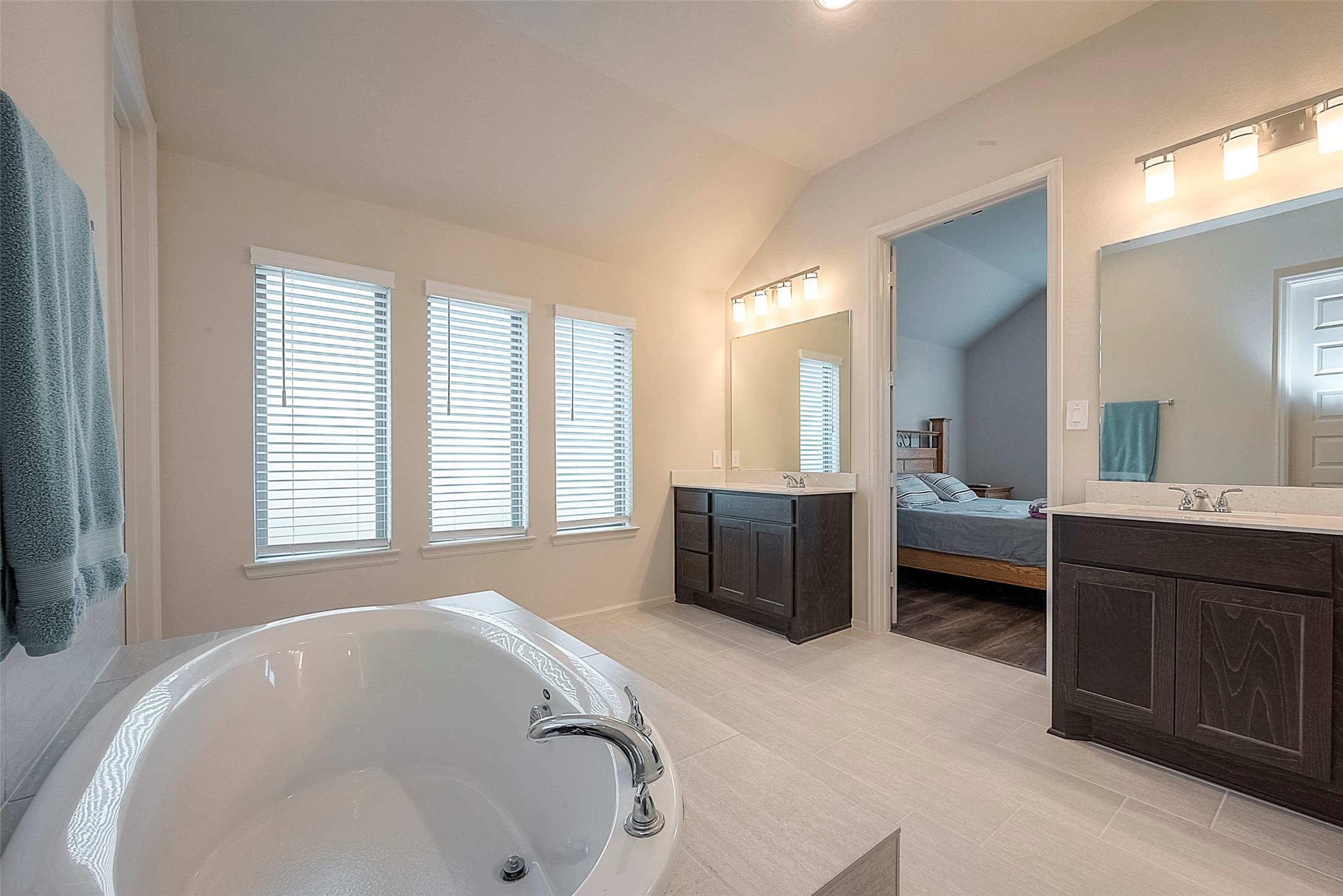 4602 Ana Ridge Lane Fulshear, TX 77441 - Photo 24 of 42 a en suite bathroom with a tub sink and mirror