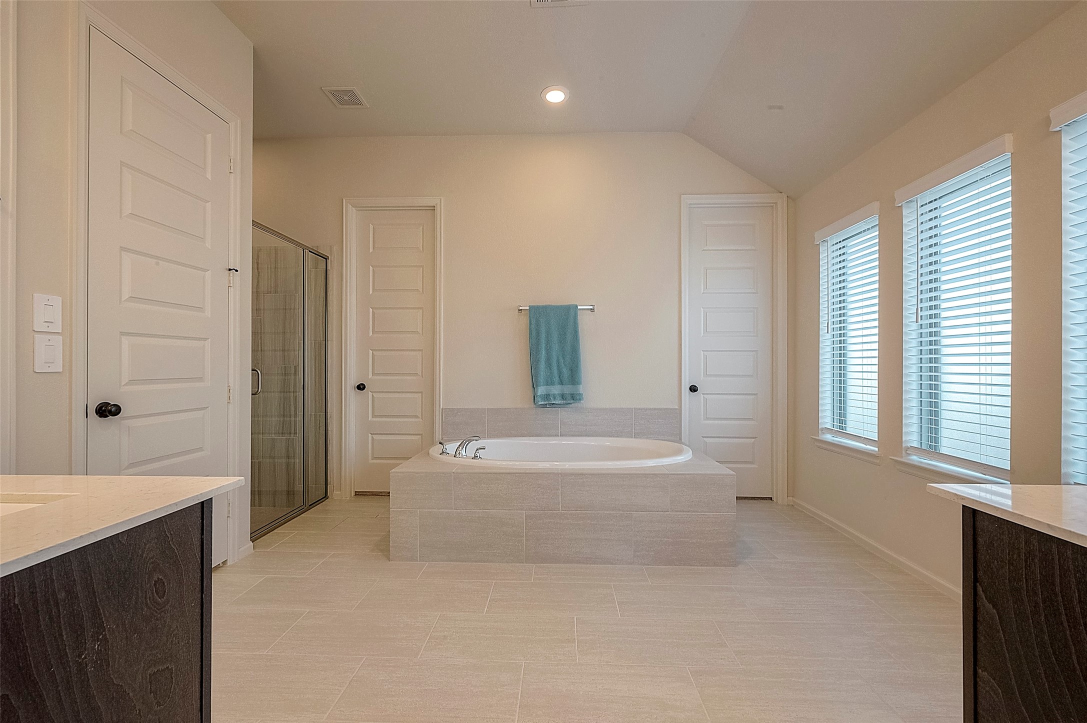 4602 Ana Ridge Lane Fulshear, TX 77441 - Photo 26 of 42 a spacious bathroom with a bathtub sink and mirror