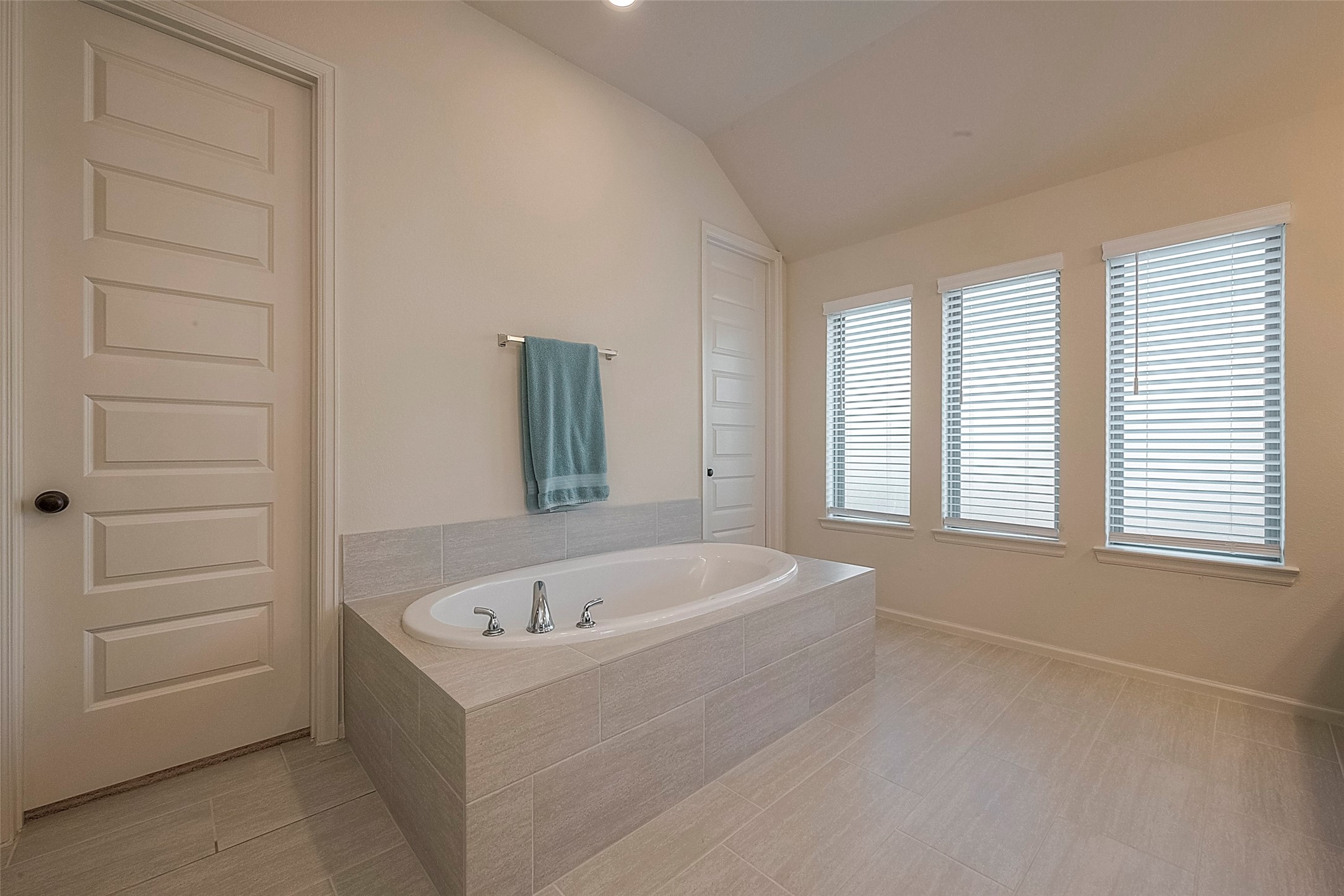 4602 Ana Ridge Lane Fulshear, TX 77441 - Photo 27 of 42 a white bath tub sitting in a bathroom next to a window