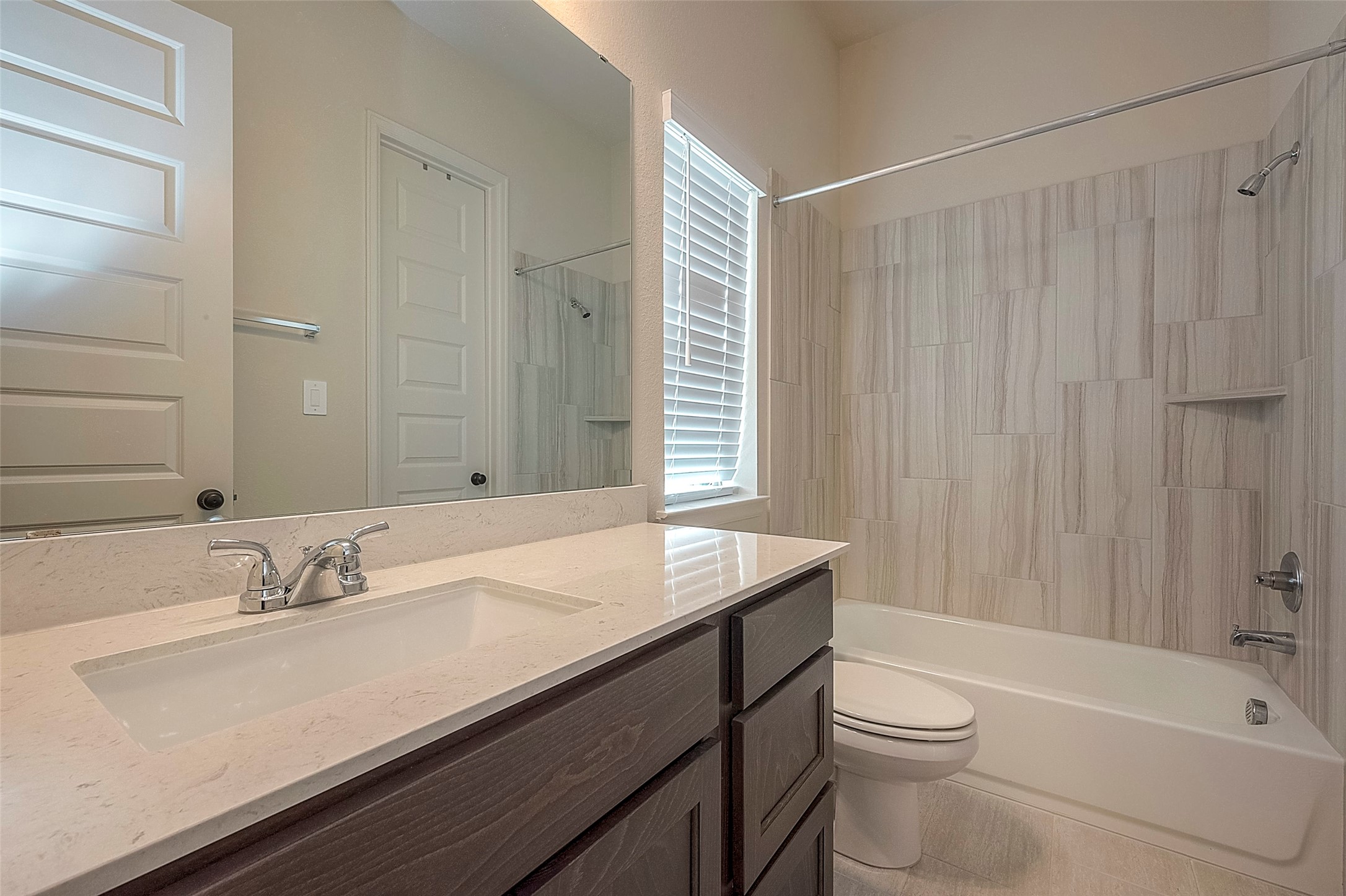 4602 Ana Ridge Lane Fulshear, TX 77441 - Photo 28 of 42 a bathroom with a sink a toilet and shower