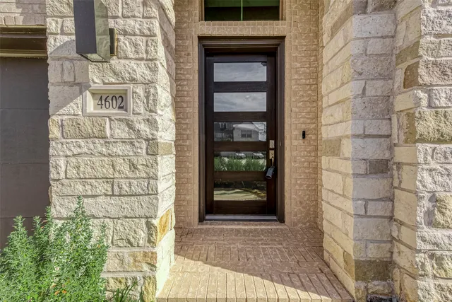 a view of a brick house with a door