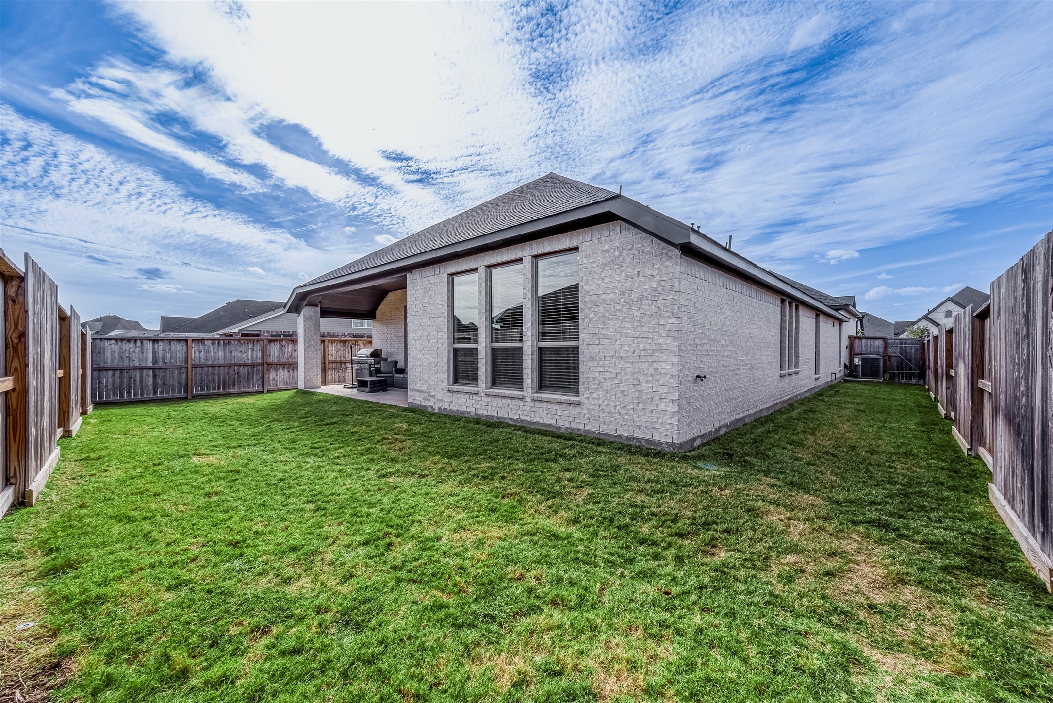 4602 Ana Ridge Lane Fulshear, TX 77441 - Photo 33 of 42 a view of a house with a backyard