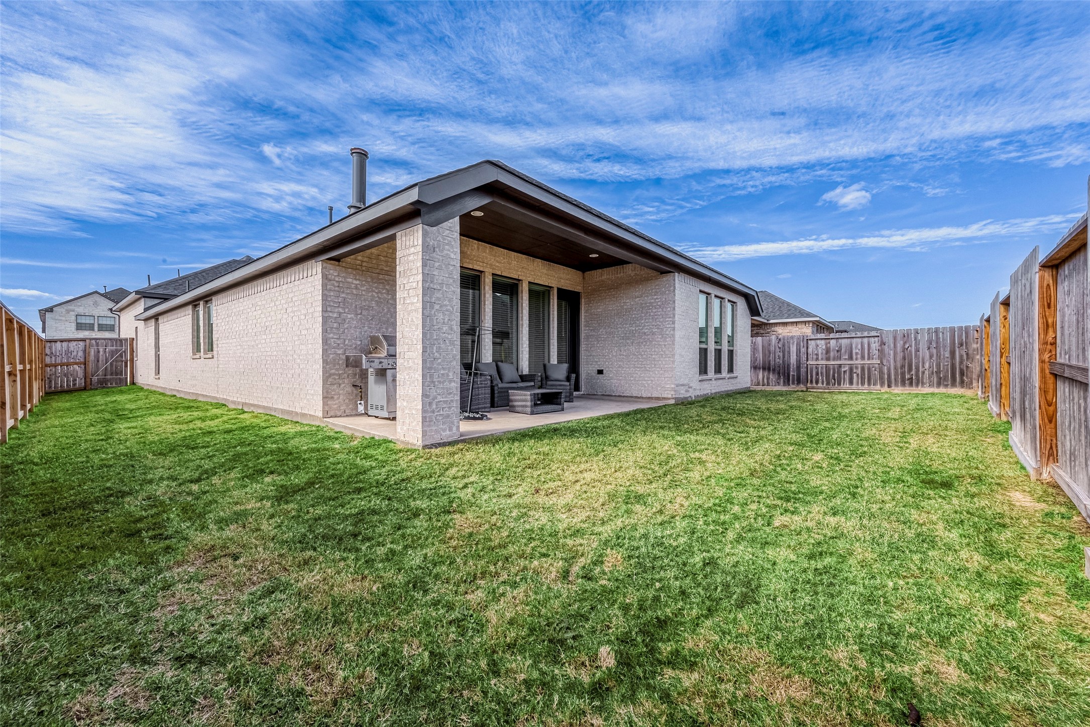 4602 Ana Ridge Lane Fulshear, TX 77441 - Photo 34 of 42 a view of a house with backyard and garden