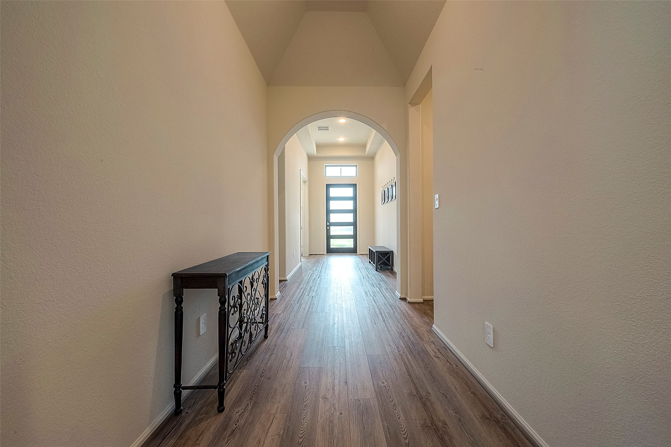 4602 Ana Ridge Lane Fulshear, TX 77441 - Photo 5 of 42 a view of a hallway with wooden floor
