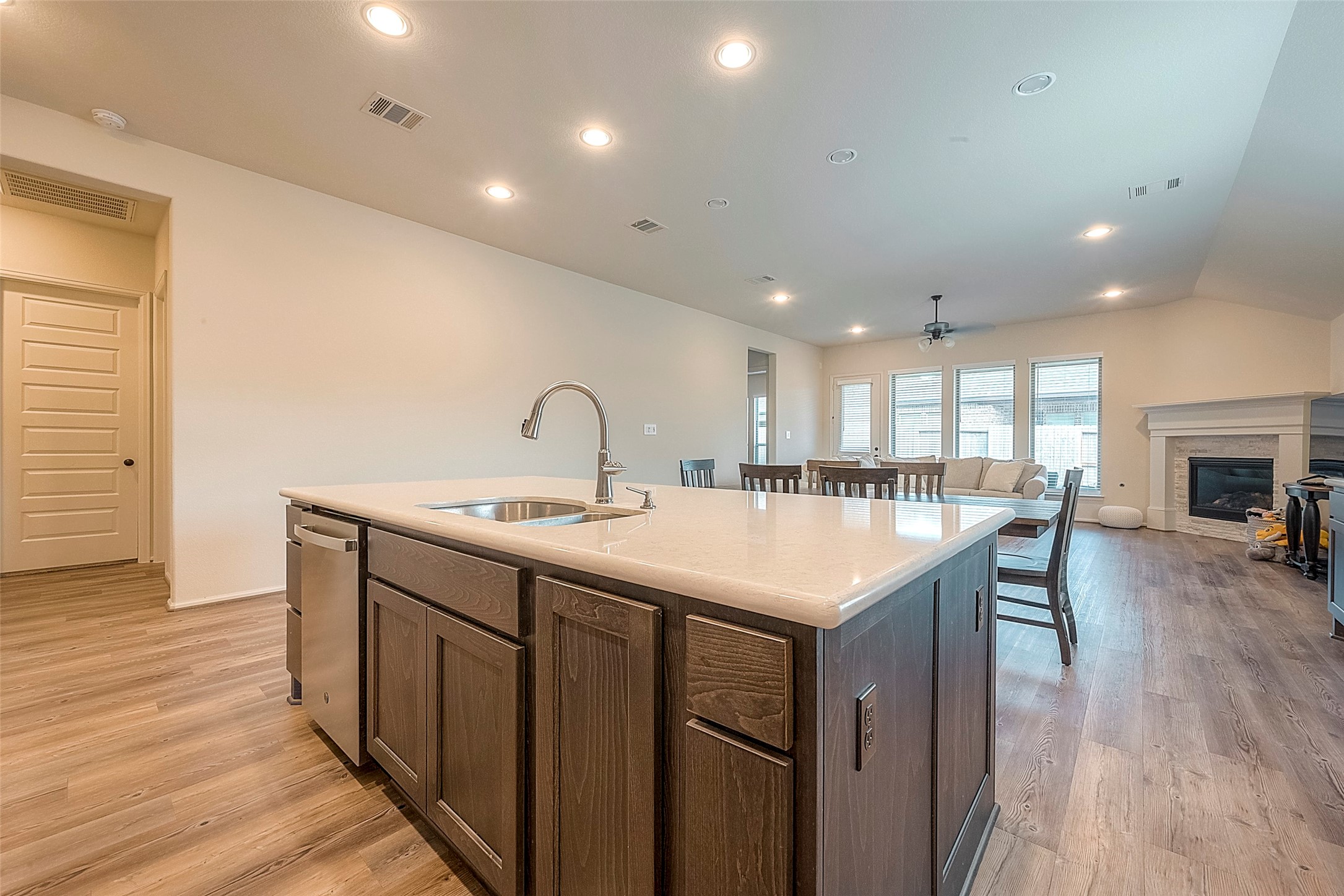 4602 Ana Ridge Lane Fulshear, TX 77441 - Photo 9 of 42 a kitchen with a sink and a refrigerator