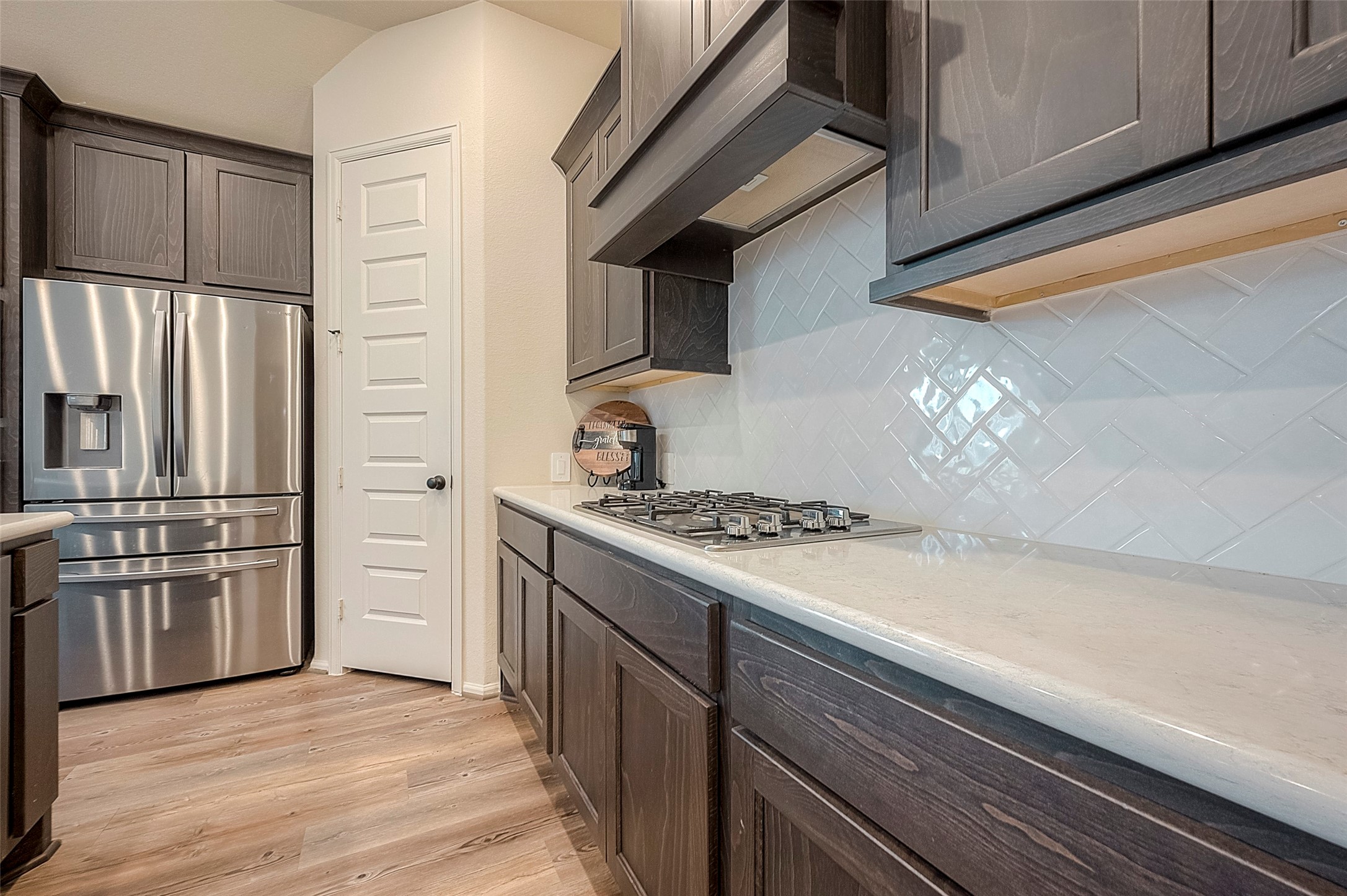 4602 Ana Ridge Lane Fulshear, TX 77441 - Photo 10 of 42 a kitchen with stainless steel appliances granite countertop a stove and a refrigerator