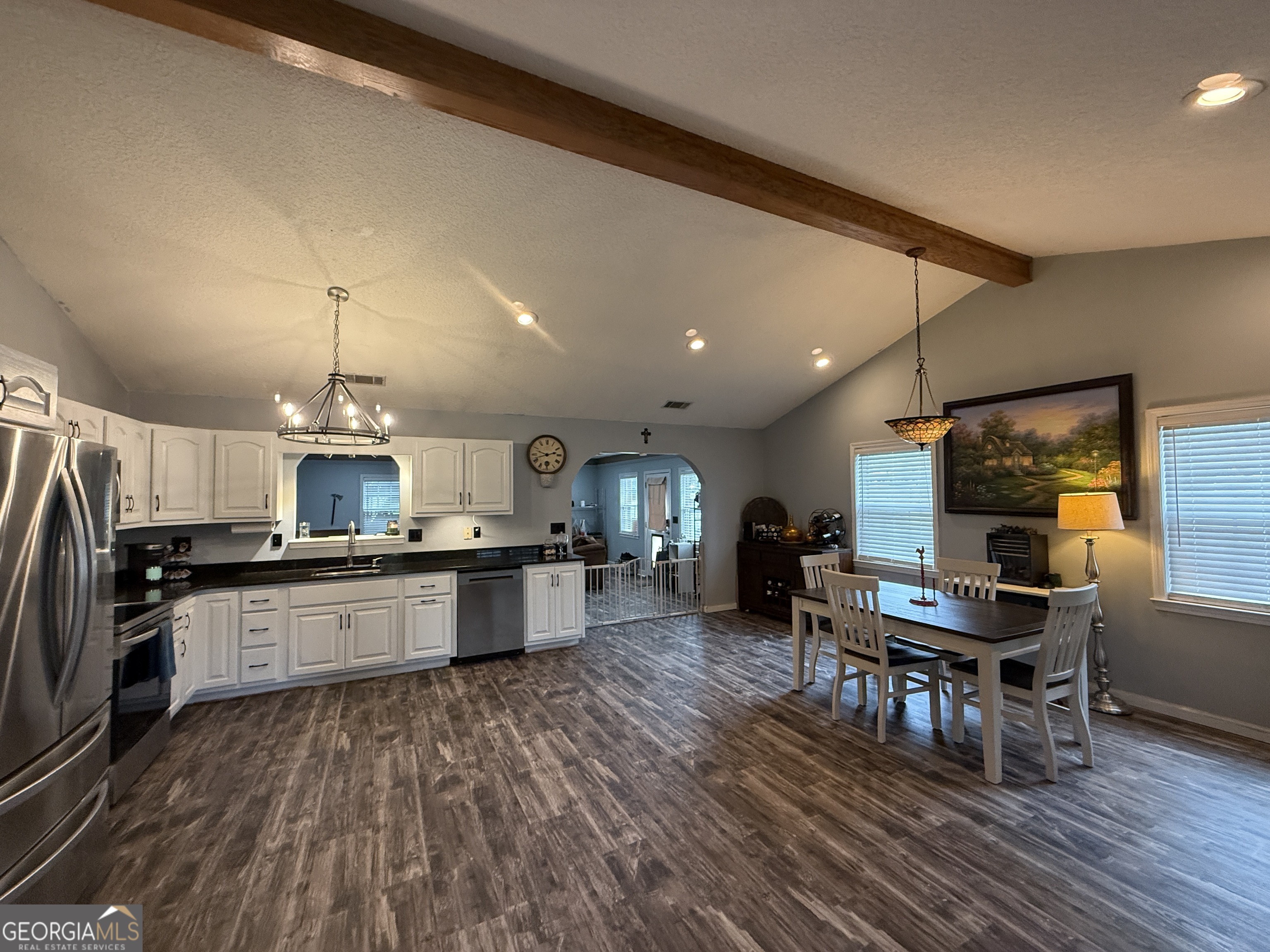 26844 Highway 46 Metter, GA 30439 - Photo 12 of 36 a kitchen with stainless steel appliances granite countertop a stove refrigerator and dining table