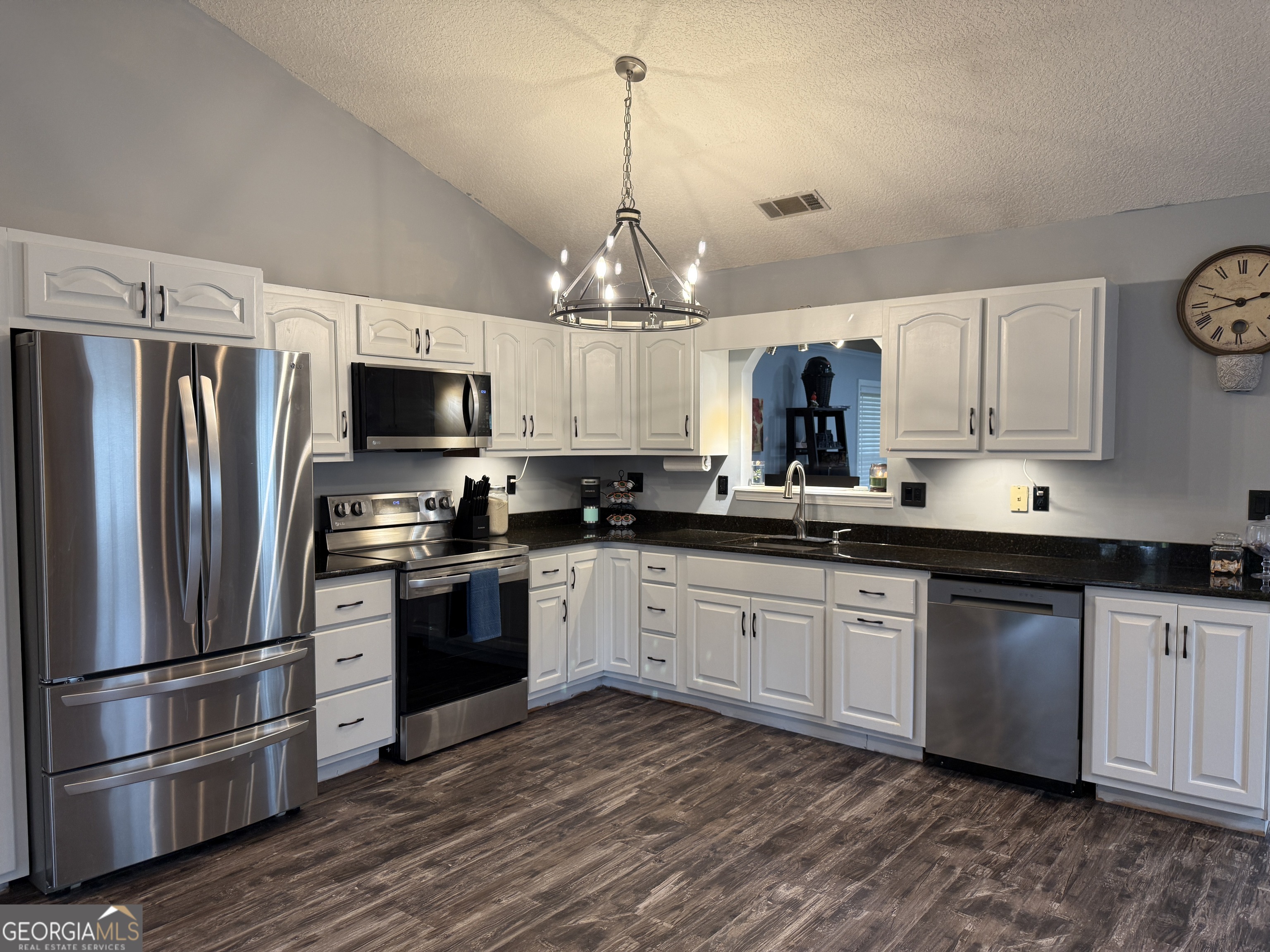 26844 Highway 46 Metter, GA 30439 - Photo 14 of 36 a kitchen with stainless steel appliances a stove a sink and a refrigerator