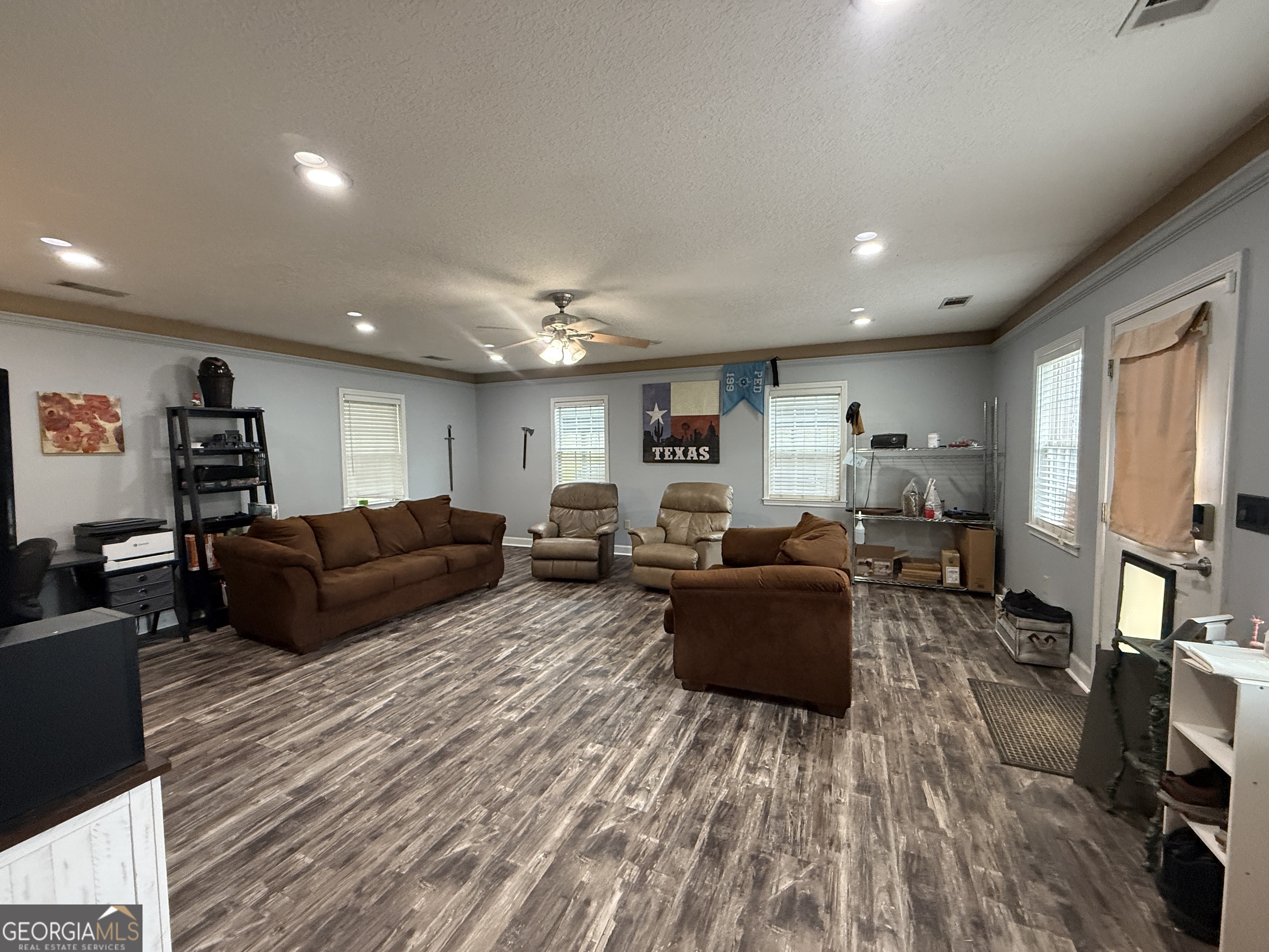 26844 Highway 46 Metter, GA 30439 - Photo 23 of 36 a living room with furniture a flat screen tv and a window