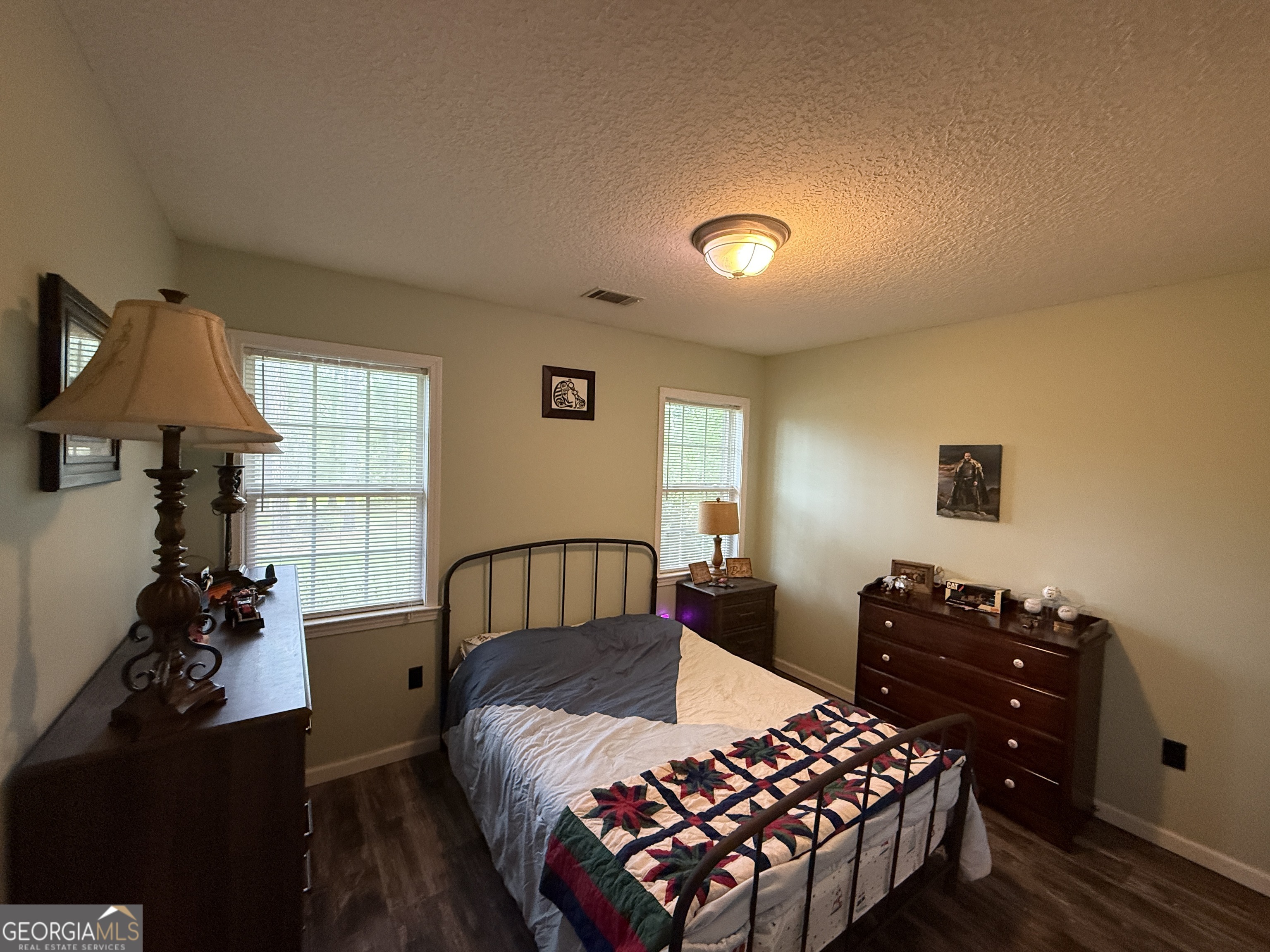 26844 Highway 46 Metter, GA 30439 - Photo 24 of 36 a bedroom with a bed and a window